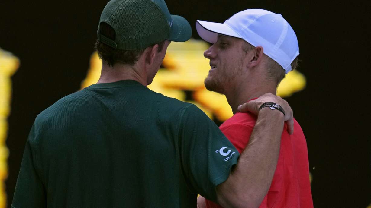 Tommy Paul of the U.S. consoles Alejandro Davidovich Fokina of Spain after a fourth round match at the Australian Open tennis championship in Melbourne, Australia, Sunday, Jan. 19, 2025.