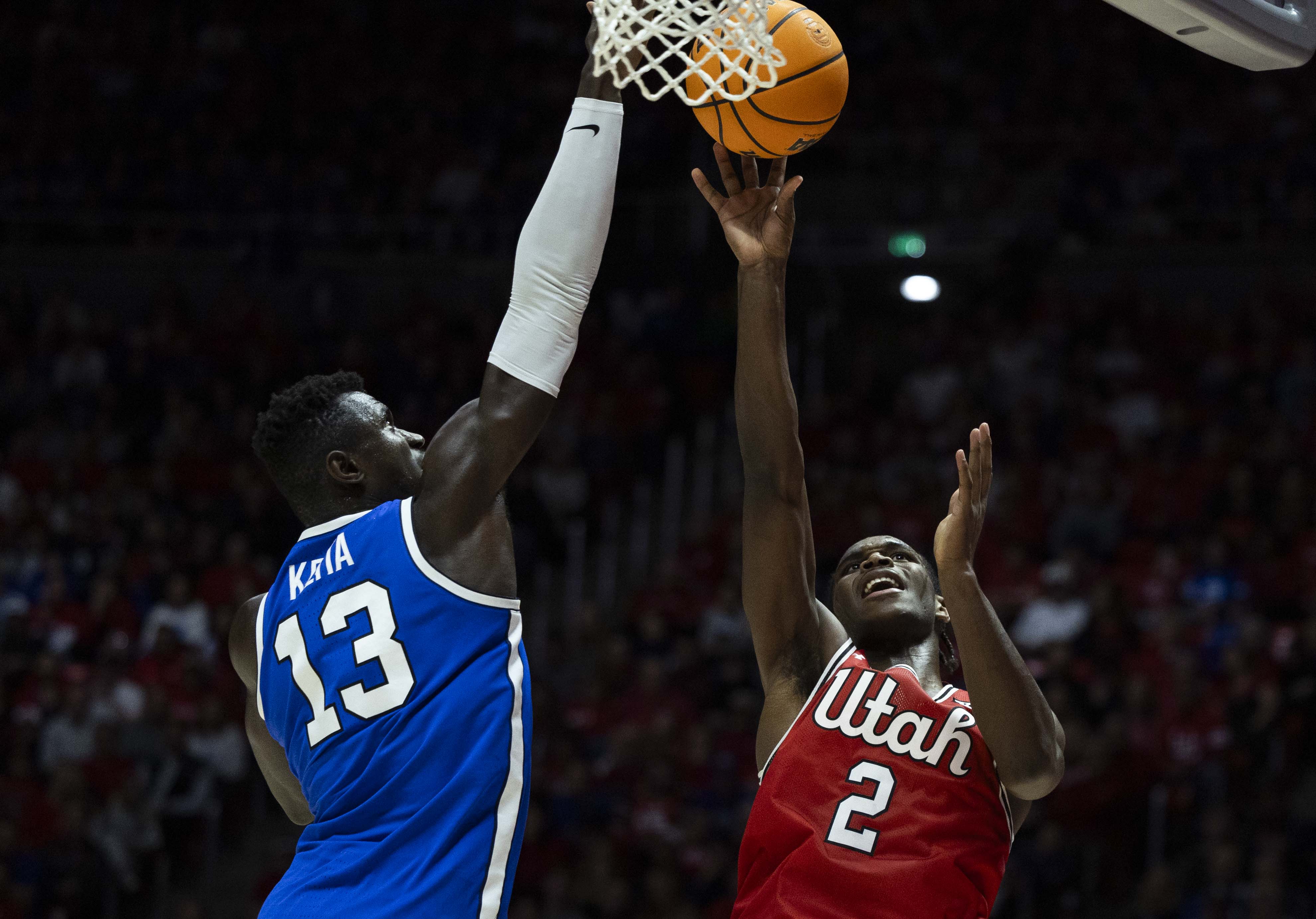 Brigham Young Cougars center Keba Keita (13) knocks a shot by Utah Utes forward Ezra Ausar (2) out of the air during a basketball game at the Jon M. Huntsman Center on the campus of the University of Utah in Salt Lake City on Saturday, Jan. 18, 2025.