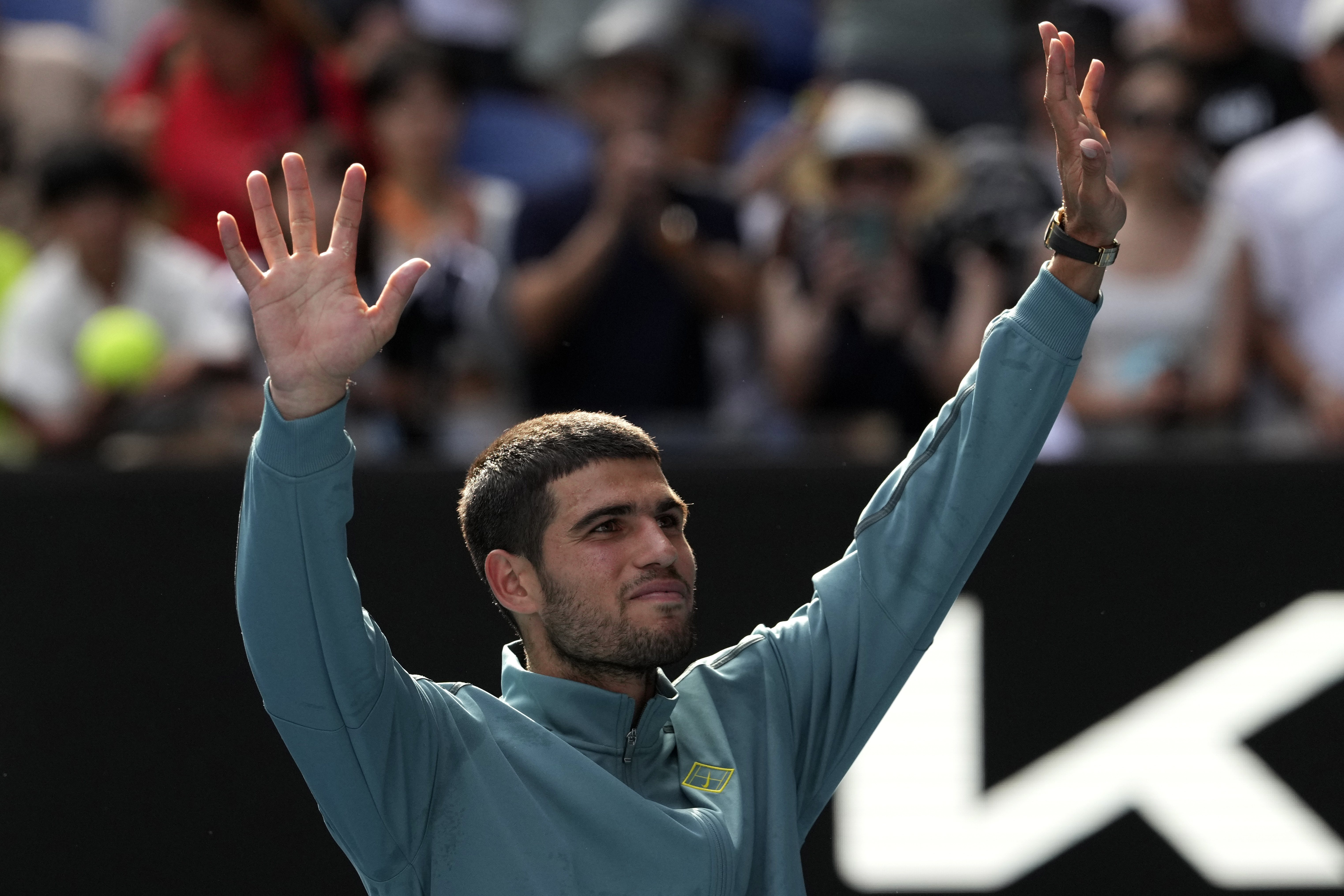 Carlos Alcaraz of Spain celebrates after winning a fourth round match against Jack Draper of Britain at the Australian Open tennis championship in Melbourne, Australia, Sunday, Jan. 19, 2025.