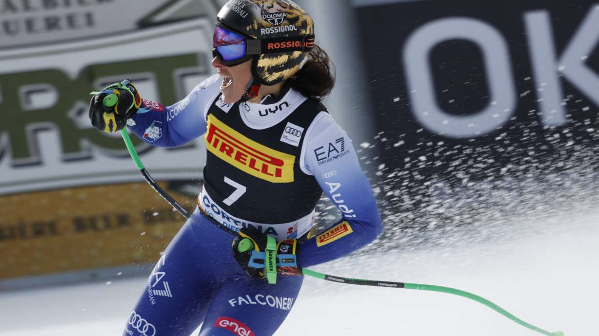Italy's Federica Brignone celebrates at the finish area of an alpine ski, women's World Cup Super-G, in Cortina d'Ampezzo, Italy, Sunday, Jan. 19, 2025