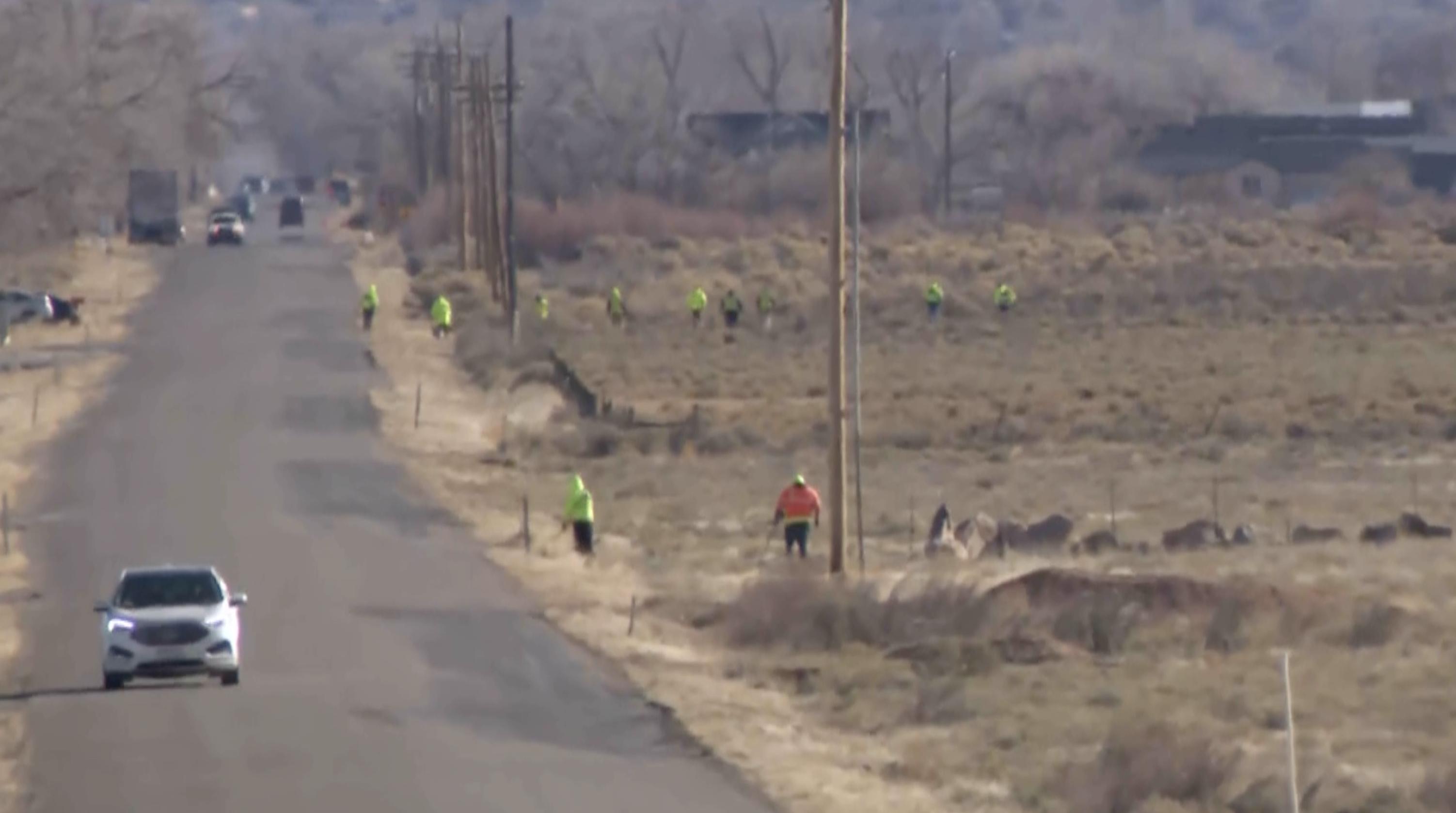 Iron County Sheriff's Office crews search the area along a stretch of road northwest of Cedar City on Saturday, looking for evidence connected to the shooting and killing of a 17-year-old driver the night before.