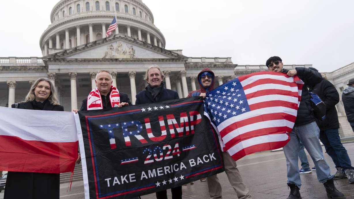 Supporters of President-elect Donald Trump take pictures as they celebrate outside of the U.S. Capitol, Sunday in Washington.
