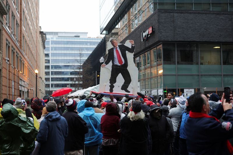 Supporters gather outside Capital One Arena, ahead of a rally for President-elect Donald Trump the day before he is scheduled to be inaugurated for a second term, in Washington, Sunday.