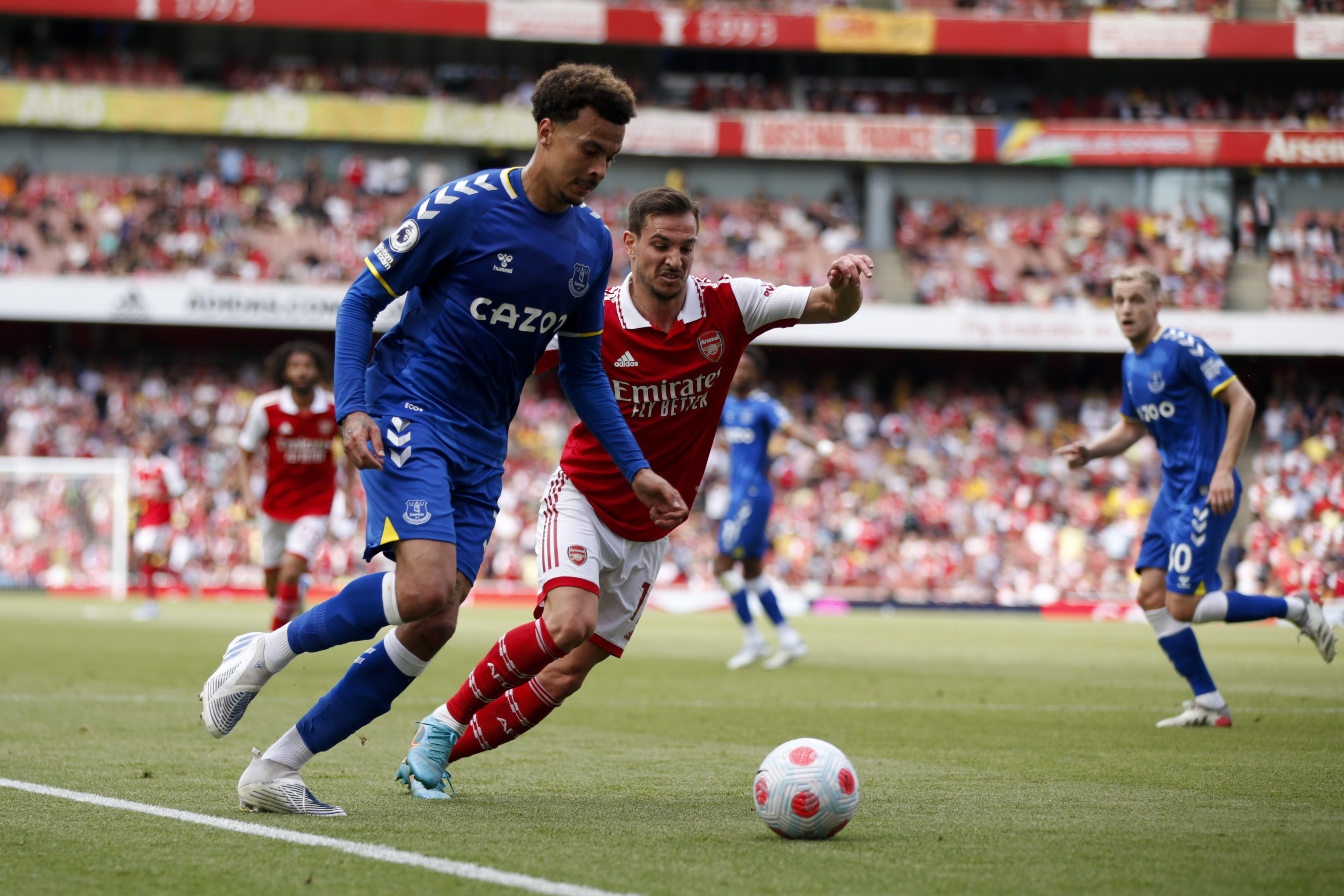 FILE - Everton's Dele Alli, left, competes for the ball with Arsenal's Cedric Soares during the English Premier League soccer match at the Emirates Stadium in London, May 22, 2022.