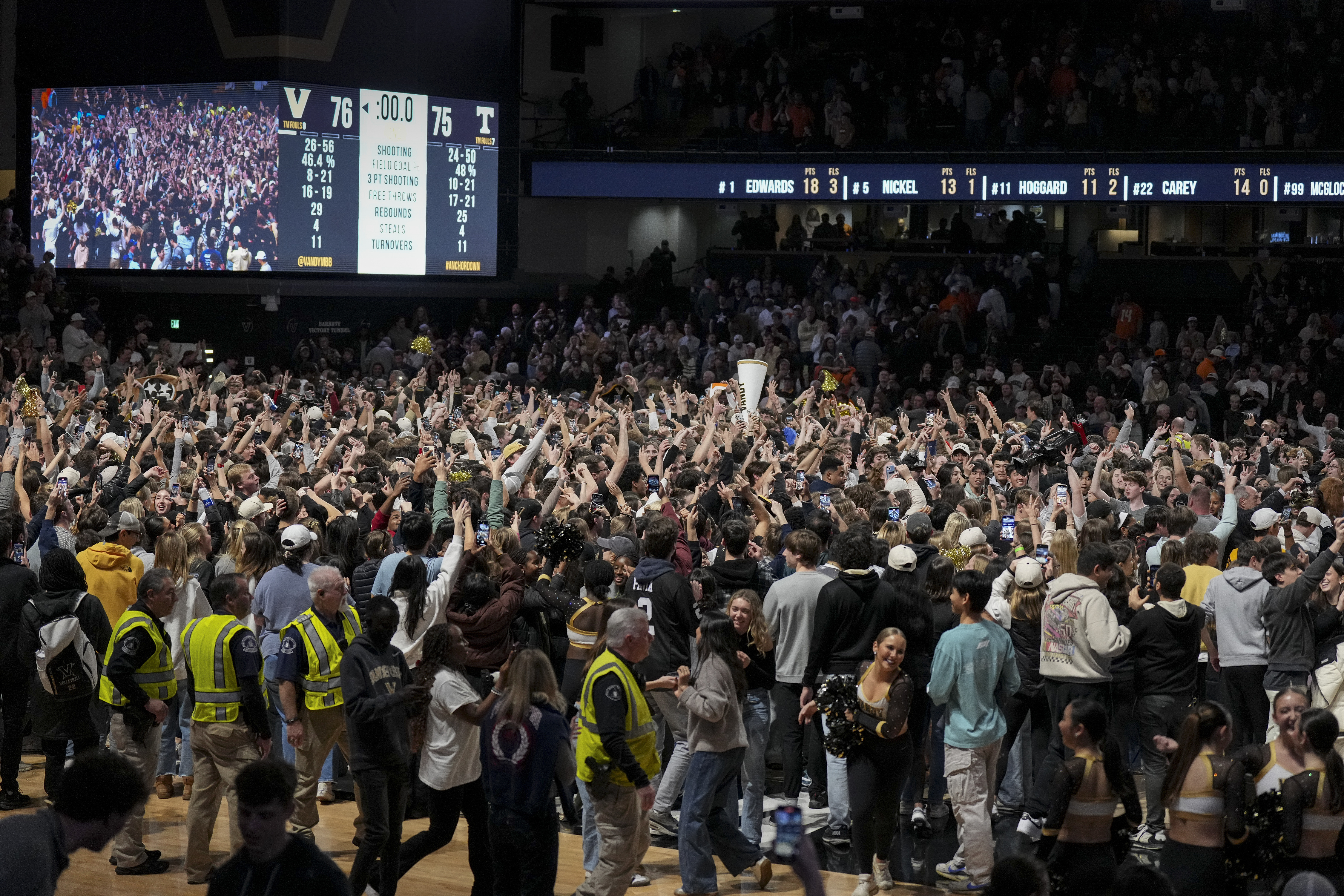 Vanderbilt fans storm the court after the team's win in an NCAA college basketball game against Tennessee, Saturday, Jan. 18, 2025, in Nashville, Tenn.