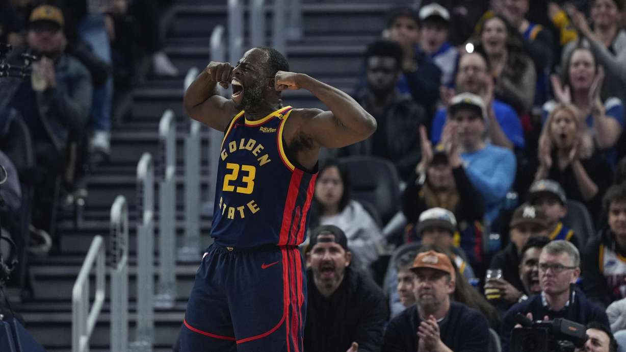 Golden State Warriors forward Draymond Green reacts after scoring against the Miami Heat during the first half of an NBA basketball game Tuesday, Jan. 7, 2025, in San Francisco.