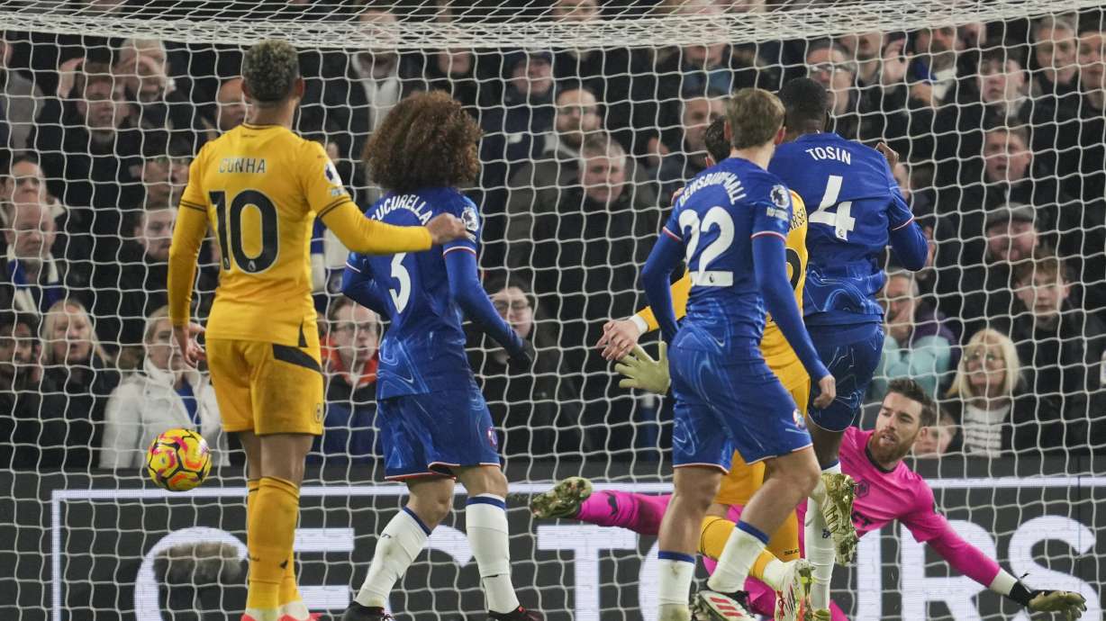 Chelsea's Tosin Adarabioyo, second right, scores the opening goal during the English Premier League soccer match between Chelsea and Wolverhampton at Stamford Bridge stadium in London, Monday, Jan. 20, 2025.