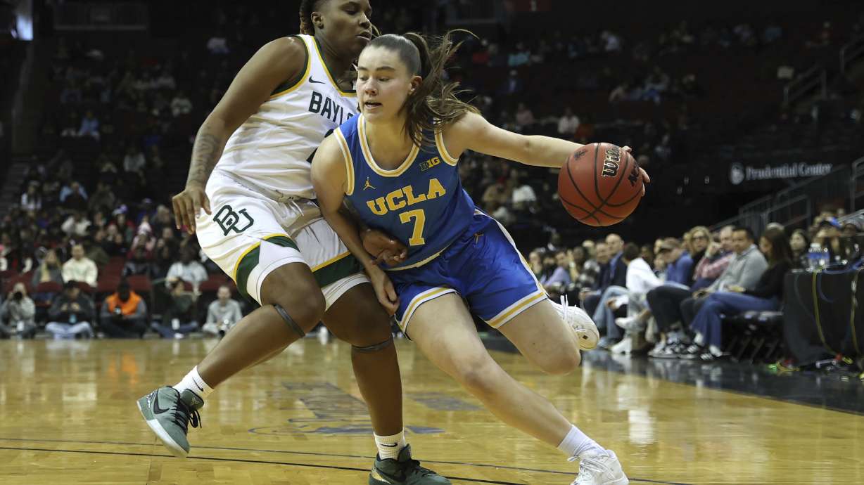 UCLA guard Elina Aarnisalo (7) dribbles against Baylor guard Yaya Felder, left, during the first half of an NCAA college basketball game Monday, Jan. 20, 2025, in Newark, N.J.