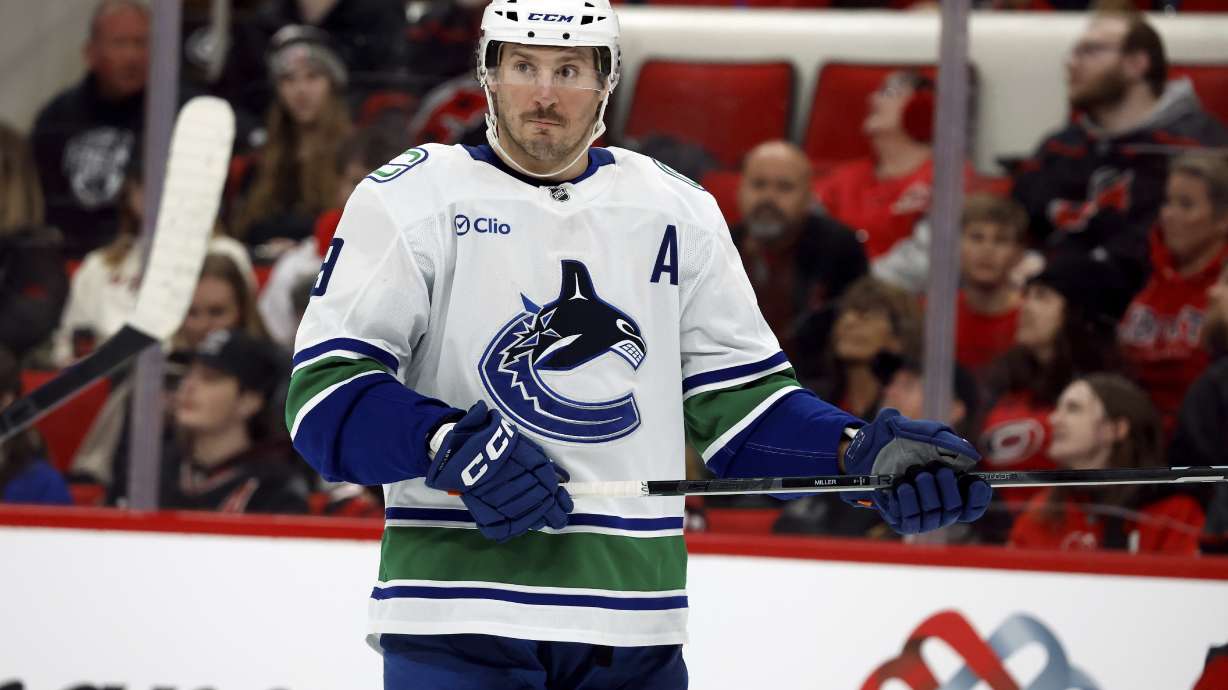 Vancouver Canucks' J.T. Miller (9) waits for a face-off against the Carolina Hurricanes during the third period of an NHL hockey game in Raleigh, N.C., Friday, Jan. 10, 2025.