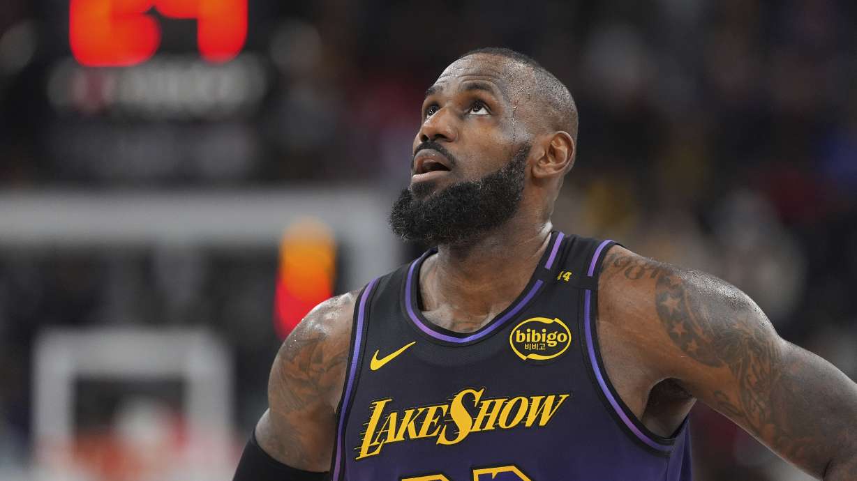 Los Angeles Lakers forward LeBron James looks toward the scoreboard during the second half of an NBA basketball game against the Los Angeles Clippers, Sunday, Jan. 19, 2025, in Inglewood, Calif.