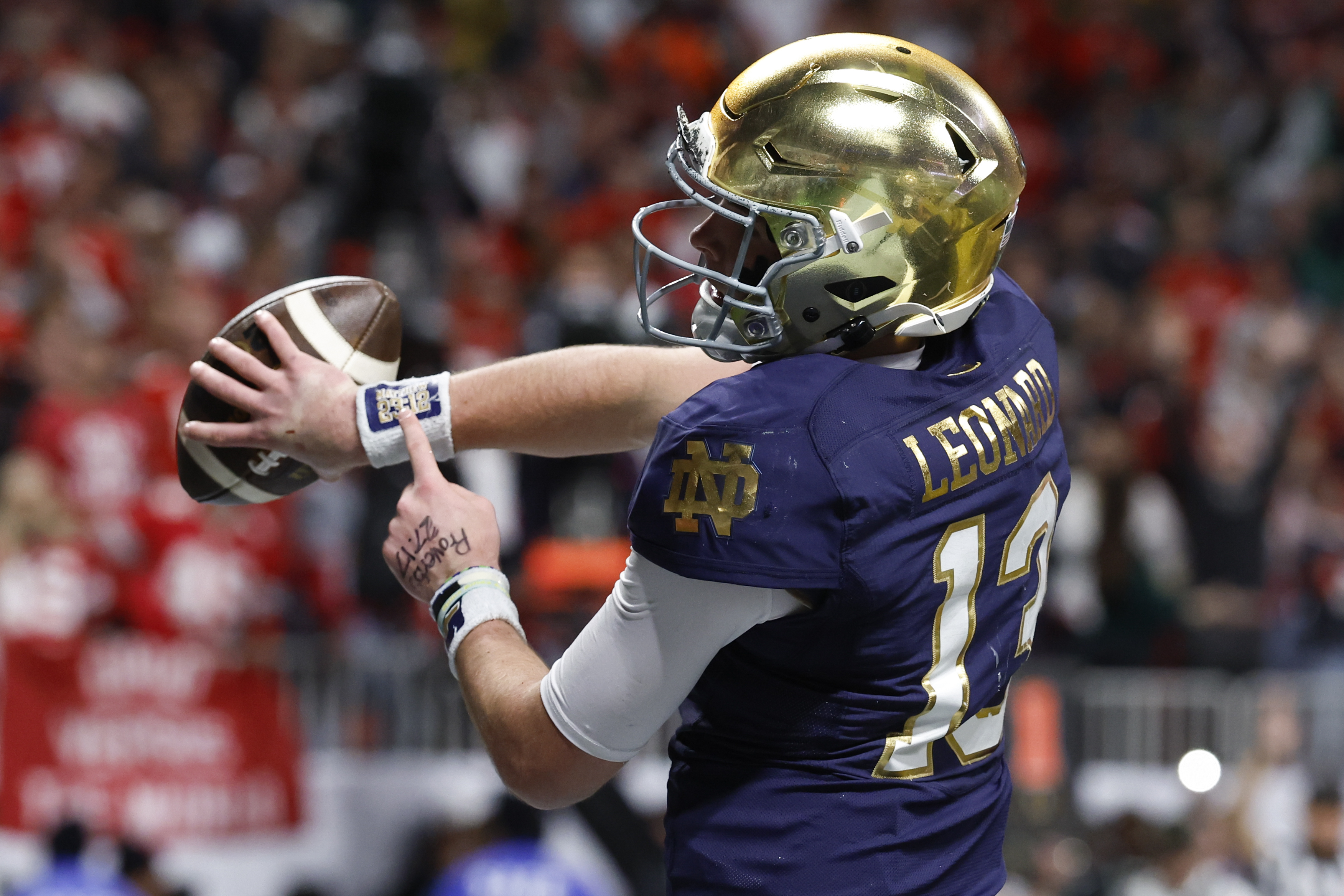 Notre Dame quarterback Riley Leonard celebrates after a touchdown against Ohio State during first half of the College Football Playoff national championship game Monday, Jan. 20, 2025, in Atlanta.