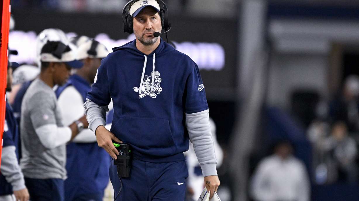 FILE - Dallas Cowboys offensive coordinator Brian Schottenheimer looks on from the sidelines during an NFL football game against the New York Giants in Arlington, Texas, Thursday, Nov. 28, 2024.
