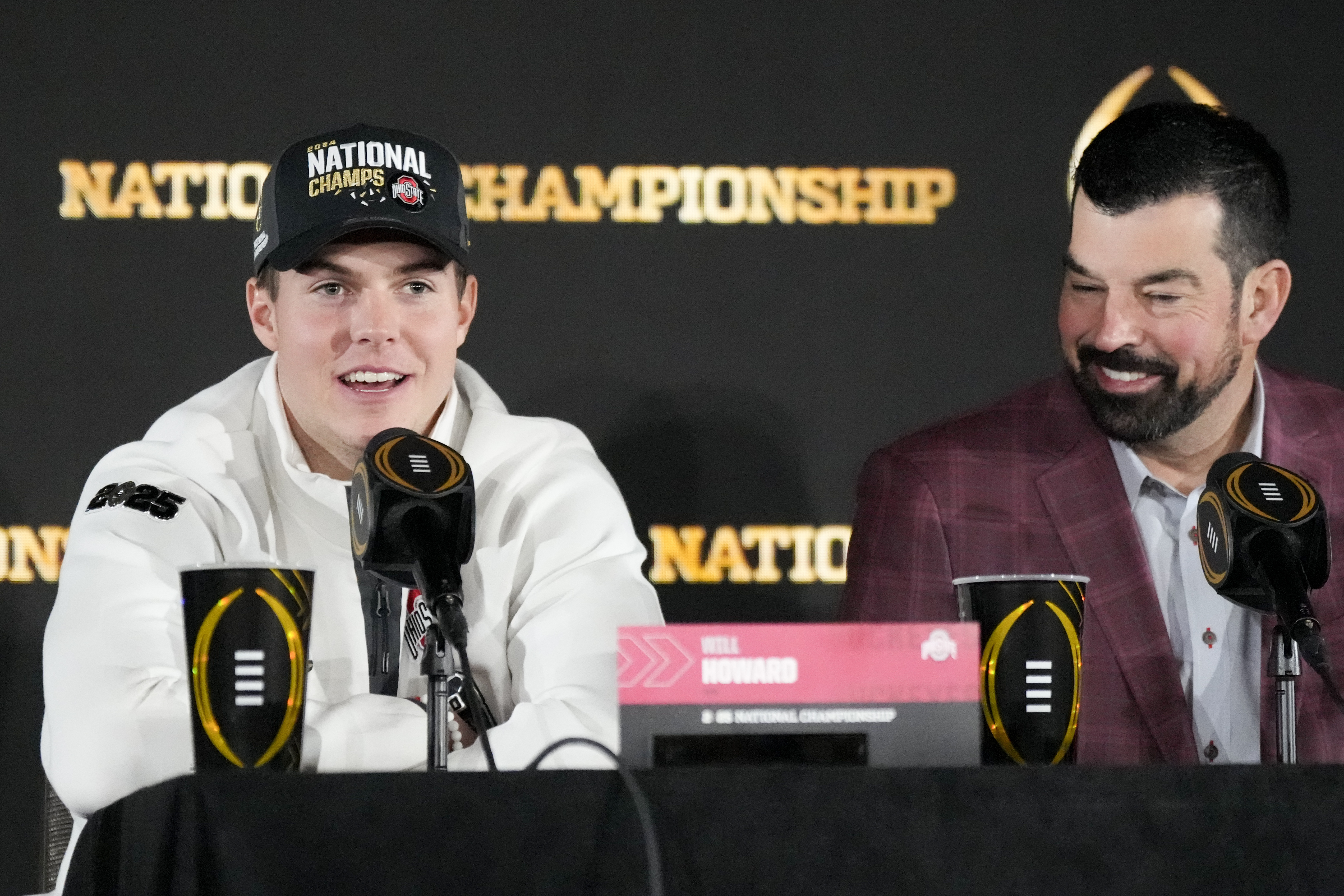 Ohio State quarterback Will Howard and head coach Ryan Day participate in the winners news conference after the College Football Playoff national championship game against Notre Dame Tuesday, Jan. 21, 2025, in Atlanta.