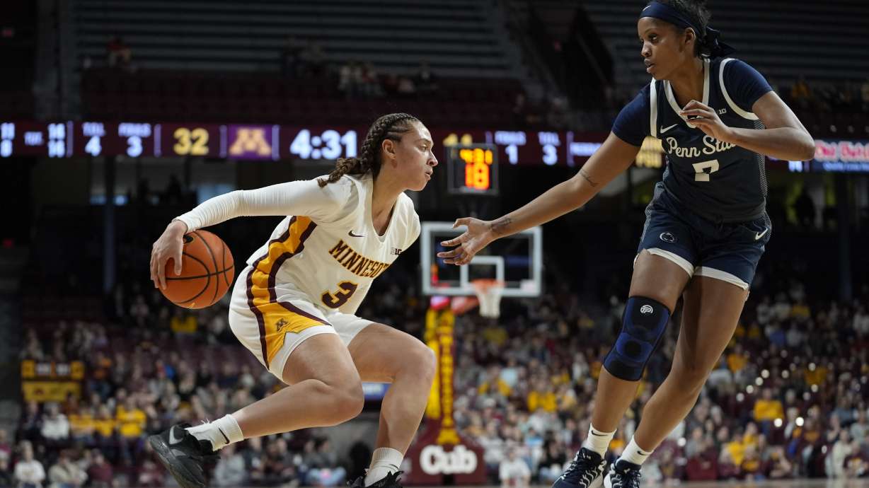 Minnesota guard Amaya Battle (3) dribbles as Penn State forward Grace Hall (7) defends during the first half of an NCAA college basketball game Saturday, Dec. 28, 2024, in Minneapolis.