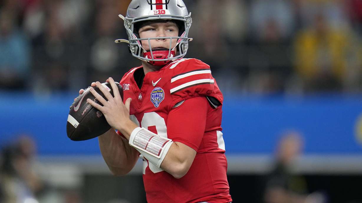 FILE - Ohio State quarterback Devin Brown looks to pass against Missouri during the first half of the Cotton Bowl NCAA college football game, Dec. 29, 2023, in Arlington, Texas.