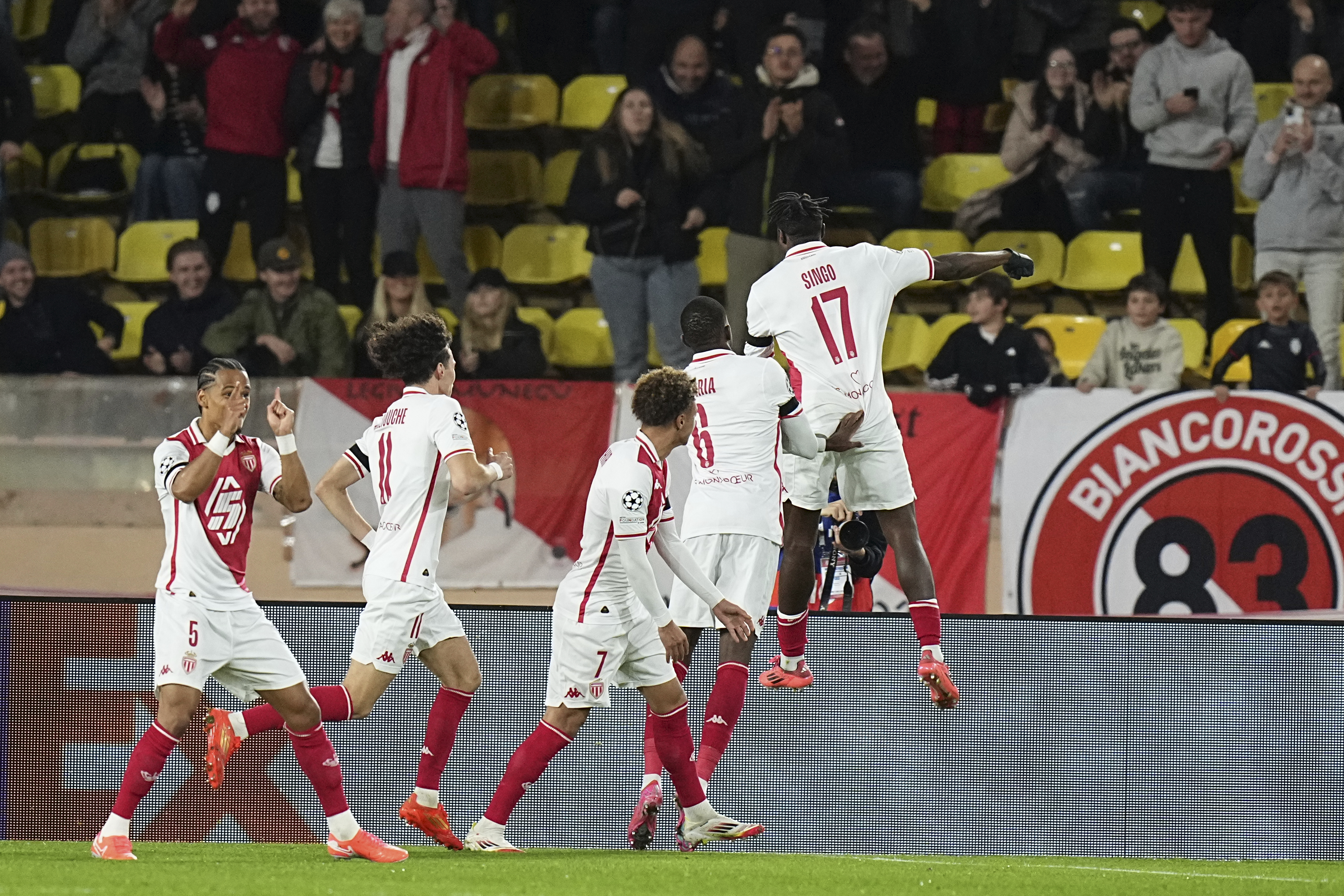 Monaco's Wilfried Singo, right, celebrates after scoring the opening goal of his team during a Champions League opening phase soccer match between Monaco and Aston Villa at the Louis II stadium in Monaco, Tuesday, Jan. 21, 2025.