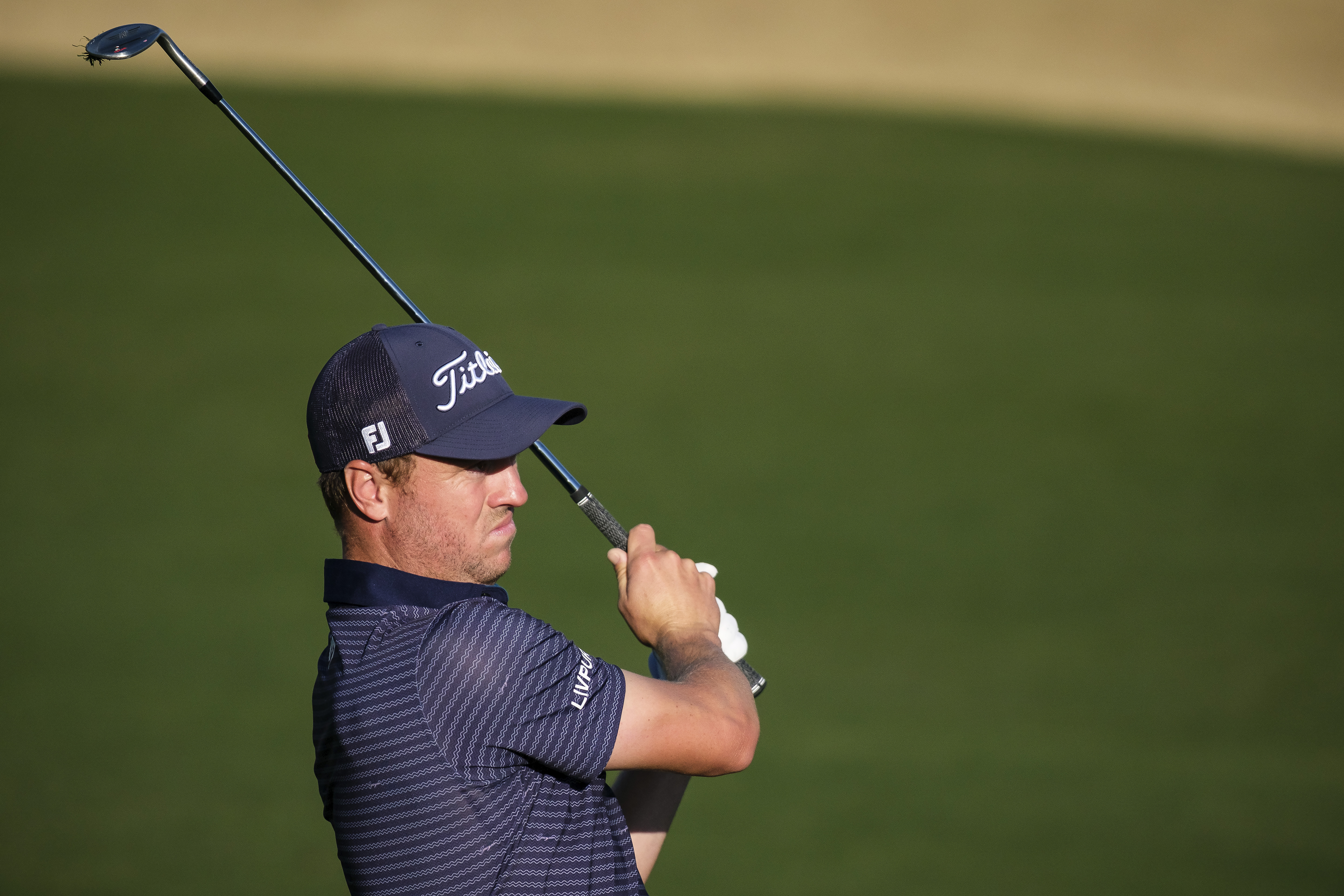 Justin Thomas hits from the 16th fairway at the Pete Dye Stadium Course during the final round of the American Express golf tournament in La Quinta, Calif., Sunday, Jan. 19, 2025.