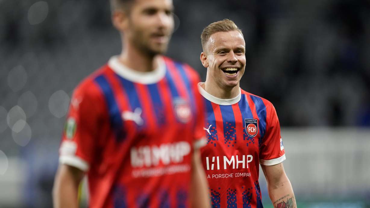 FILE - Heidenheim's Lennard Maloney, right, celebrates with teammate following aEuropa Conference League opening phase soccer match between Pafos and Heidenheim, at Alpha Mega stadium in Limassol, Cyprus, Thursday, Oct. 24, 2024.