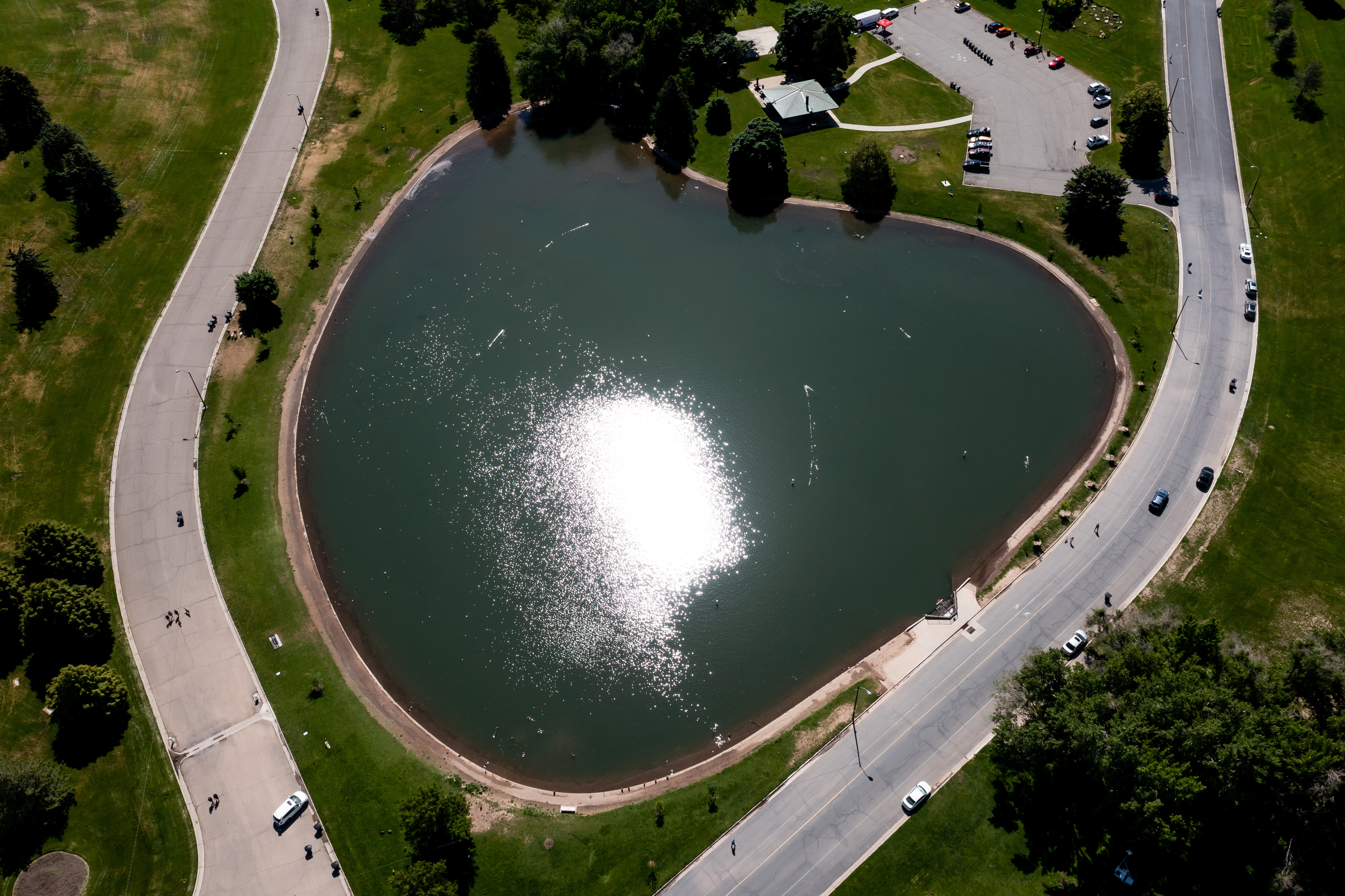 The pond at Sugar House Park in Salt Lake City is pictured on June 1, 2023. Salt Lake City passed a gas station ordinance Tuesday that was inspired by a rejected proposal to build a station near the park's pond.