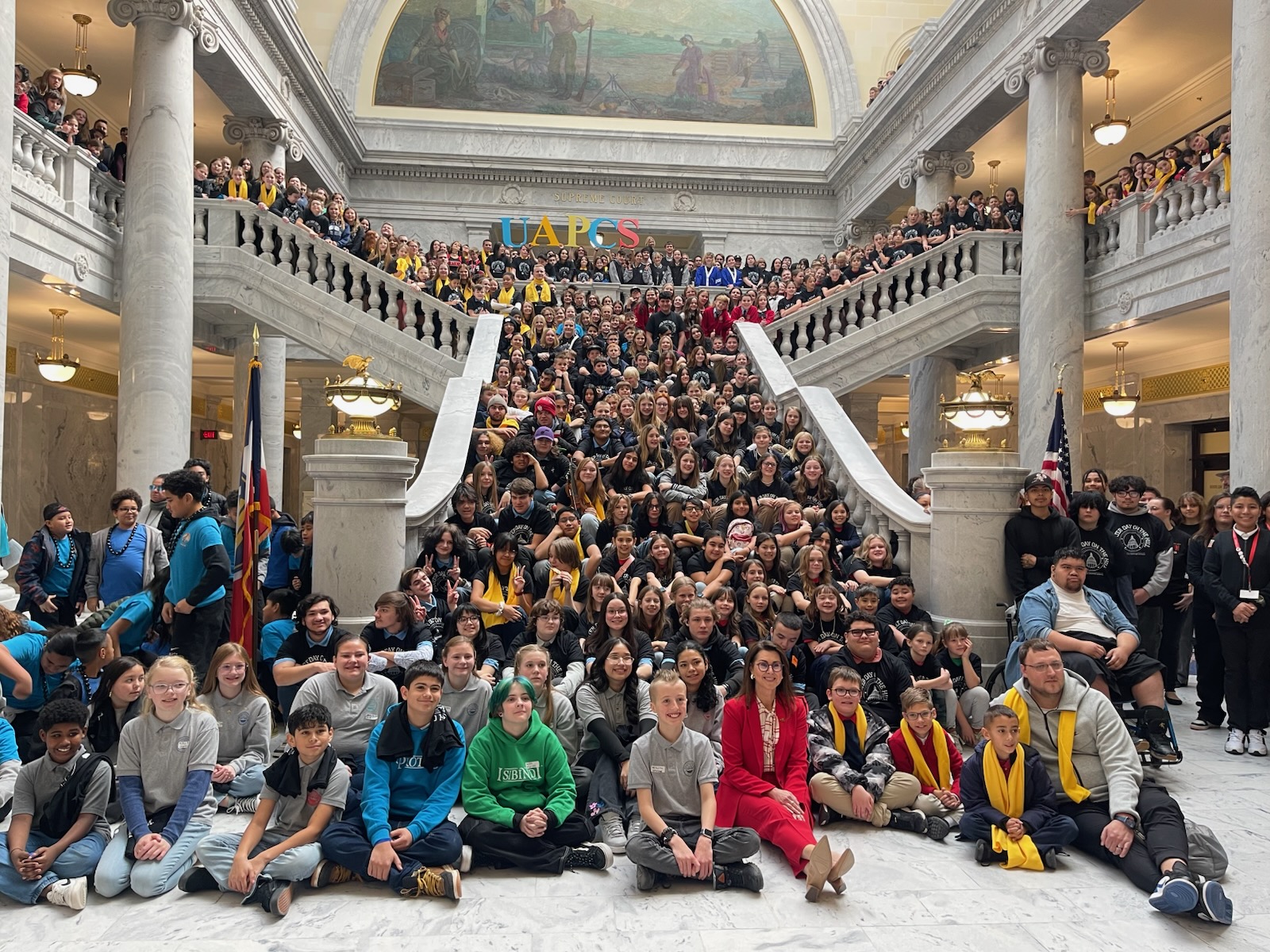 Utah Lt. Gov. Deidre Henderson poses for a picture with charter school students at the Utah Capitol on Tuesday. Around 1,000 students gathered at the Utah Capitol Monday to advocate for school choice.