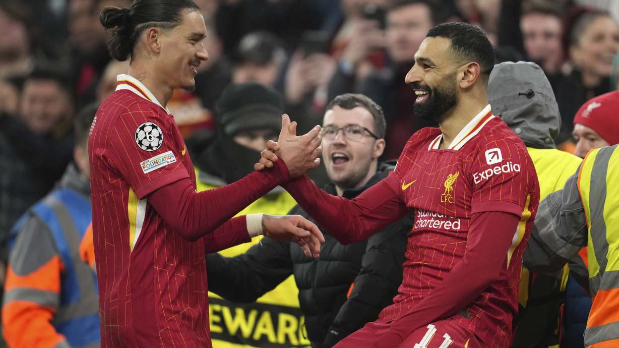 Liverpool's Mohamed Salah, celebrates with his teammate Darwin Nunez after scoring his side's first goal during the Champions League, opening phase soccer match between Liverpool and Lille at Anfield Stadium, Liverpool, England, Tuesday, Jan.21, 2025.