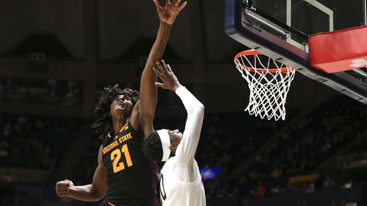 Arizona State forward Jayden Quaintance (21) blocks West Virginia guard Sencire Harris (10) layup during the first half of an NCAA college basketball game, Tuesday, Jan. 21, 2025, in Morgantown, W.Va.