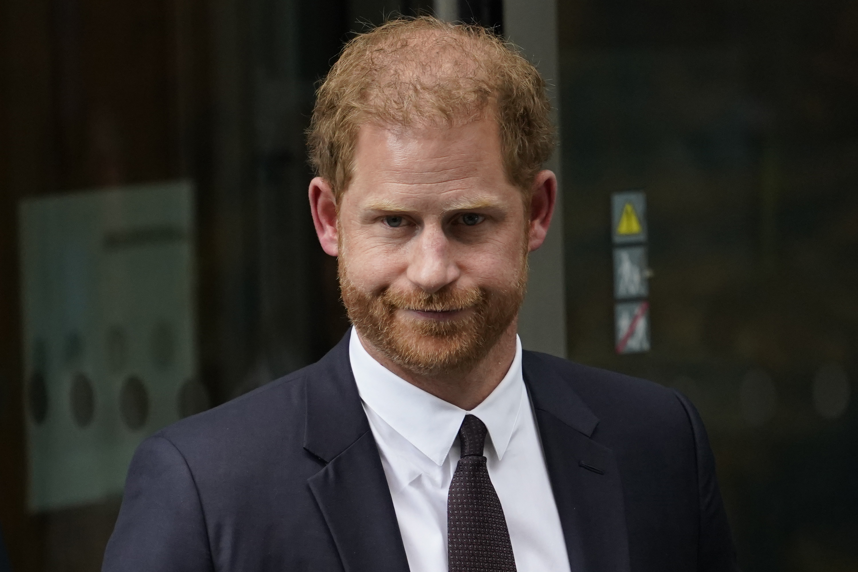 Prince Harry leaves the High Court after providing evidence in London, June 6, 2023. Rupert Murdoch's U.K. tabloids made an unprecedented apology for intruding in his life.