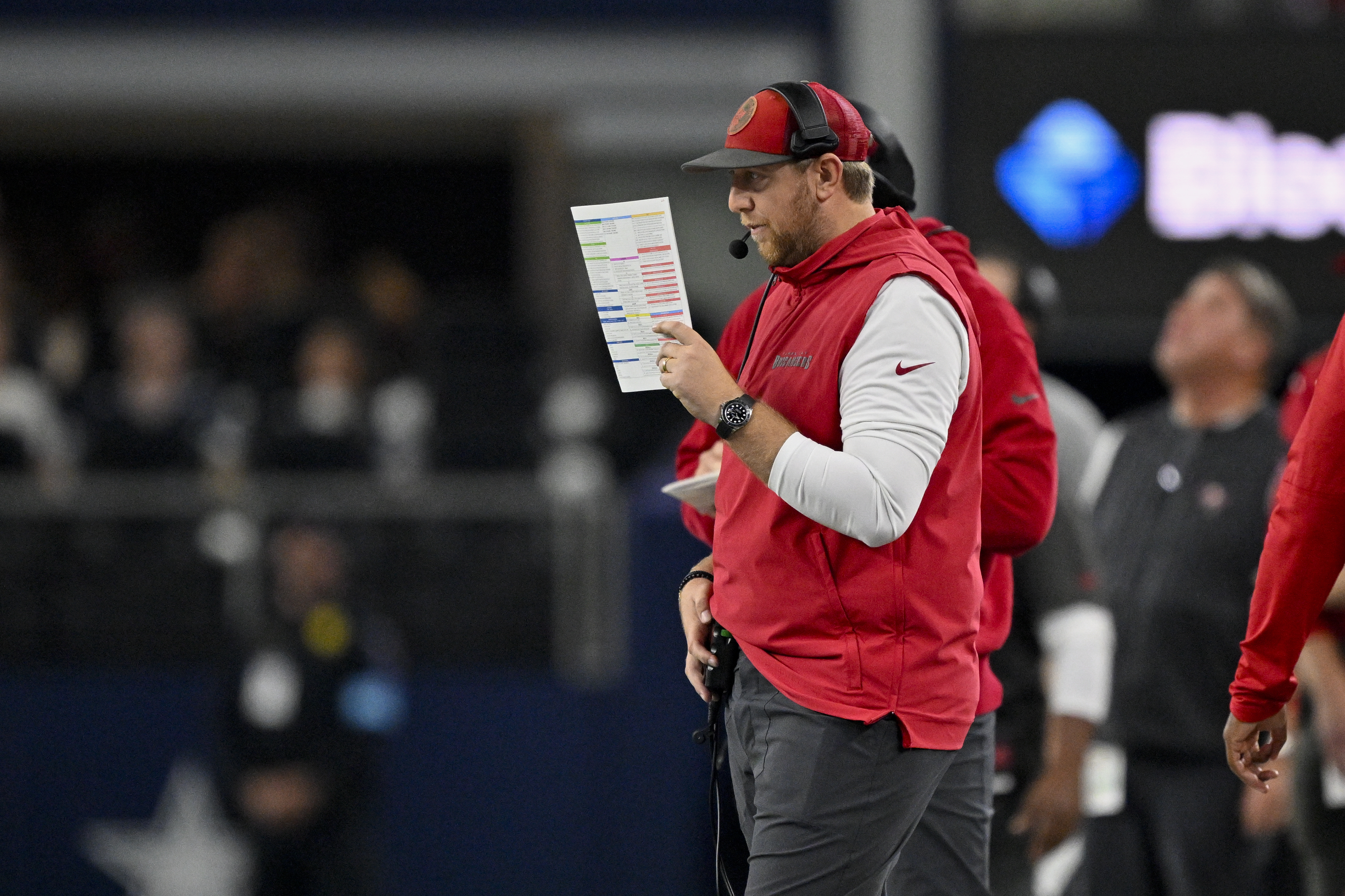 FILE - Tampa Bay Buccaneers offensive coordinator Liam Coen looks on from the sidelines during an NFL football game against the Dallas Cowboys in Arlington, Texas, Dec. 22, 2024.
