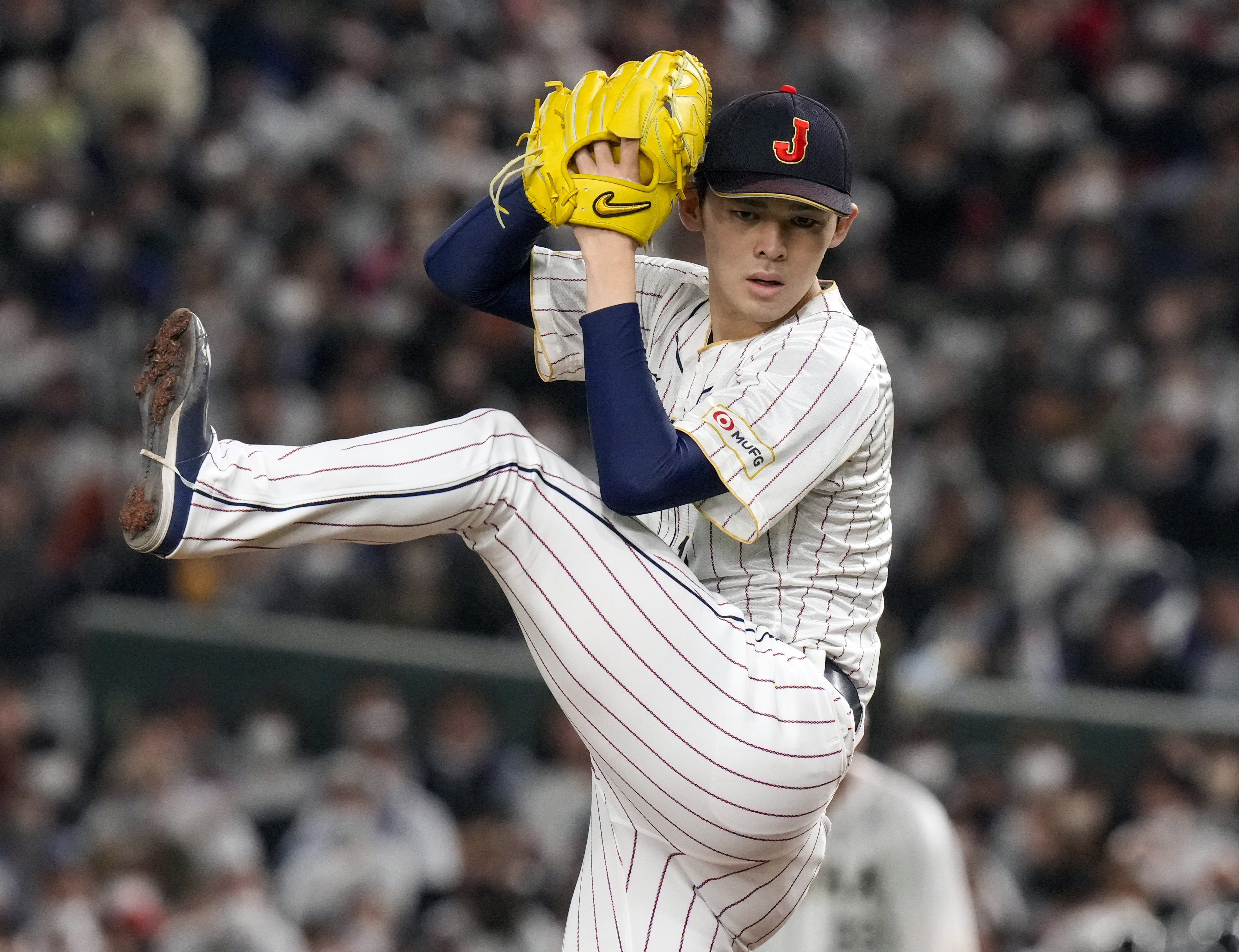 FILE - Roki Sasaki, of Japan, pitches during their Pool B game against the Czech Republic at the World Baseball Classic at the Tokyo Dome in Japan, March 11, 2023.