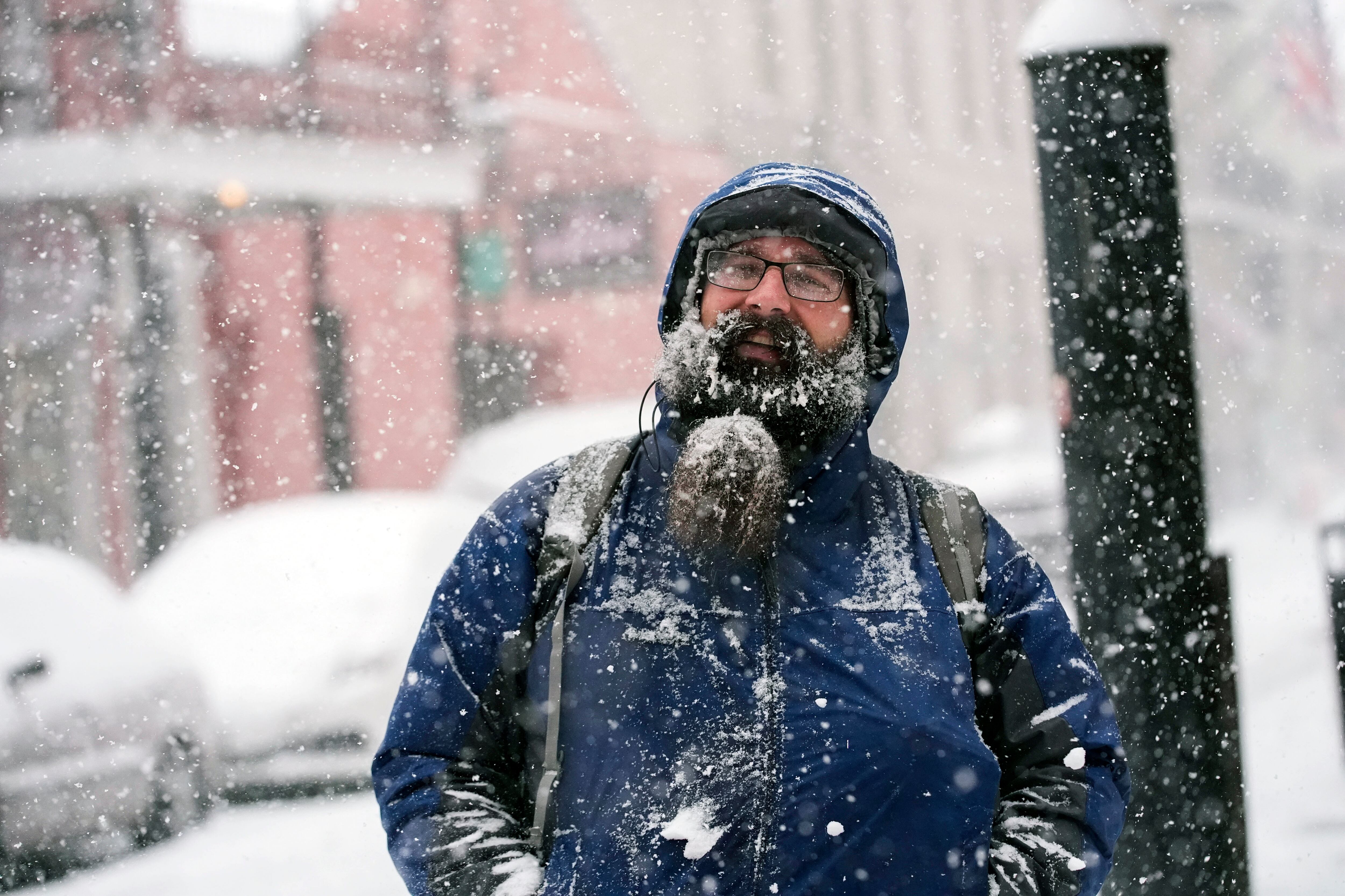 Johnathan Duval, visiting from Jacksonville, Fla., takes in the snow during a very rare snowstorm in the French Quarter of New Orleans, Tuesday.