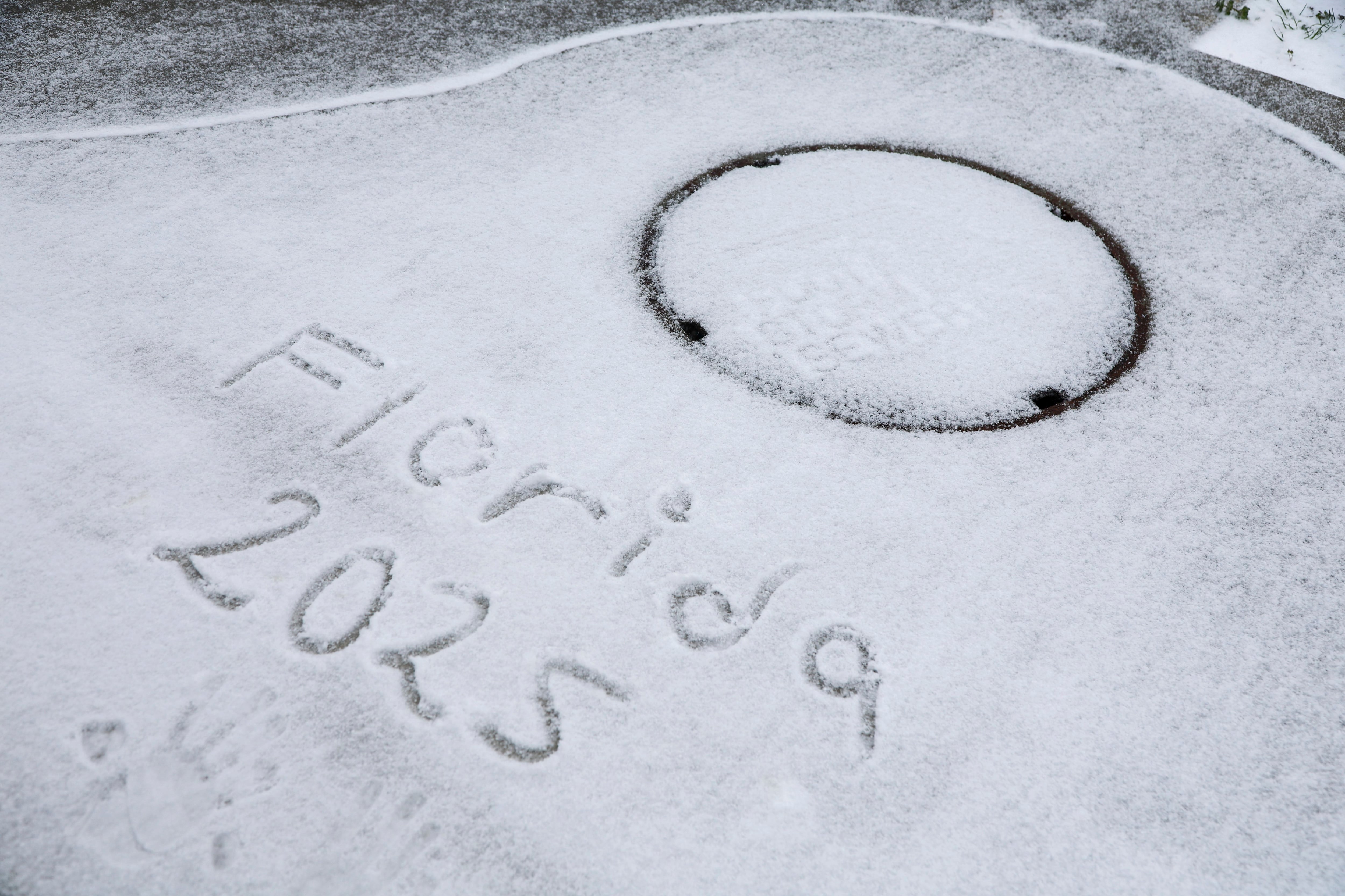 Heavy snow falls onto the street on Tuesday, in Pensacola, Fla.