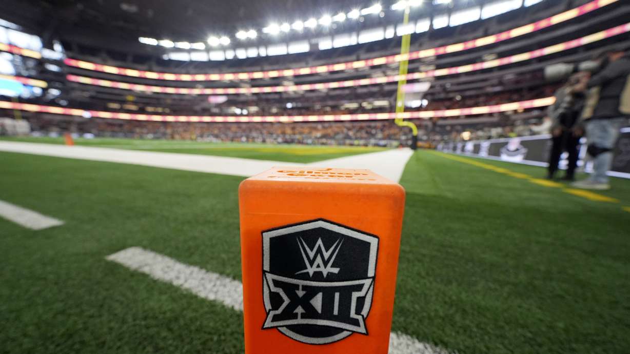 FILE - Big 12 Conference logo is displayed on a pylon during the Big 12 conference championship NCAA college football game between Arizona State and Iowa State in Arlington, Texas, Saturday Dec. 7, 2024.