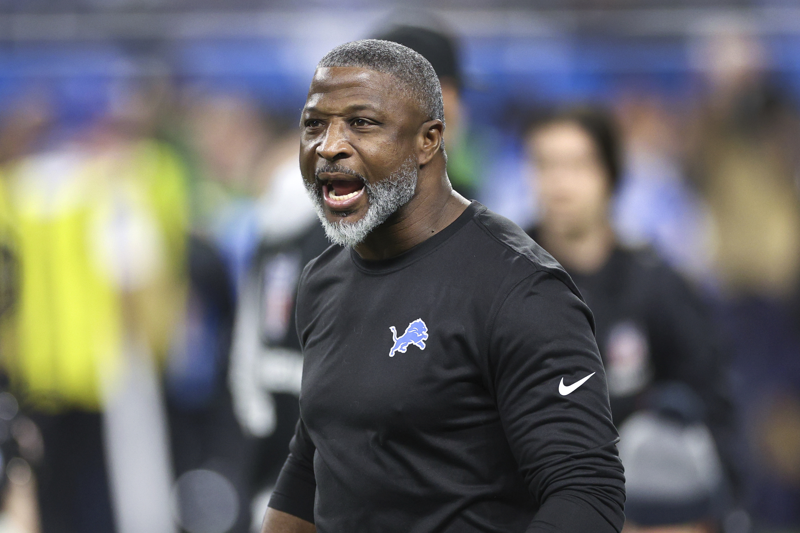 Detroit Lions defensive coordinator Aaron Glenn watches during warmups before an NFL football divisional playoff game against the Washington Commanders, Saturday, Jan. 18, 2025, in Detroit. 