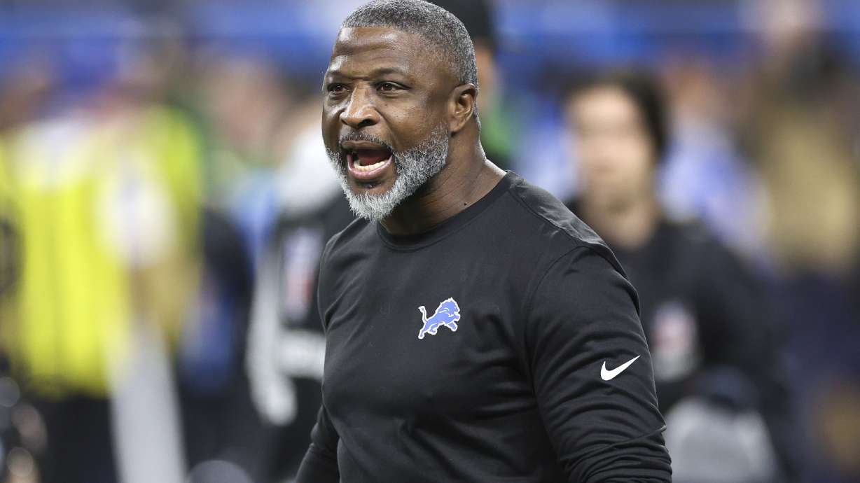 Detroit Lions defensive coordinator Aaron Glenn watches during warmups before an NFL football divisional playoff game against the Washington Commanders, Saturday, Jan. 18, 2025, in Detroit.