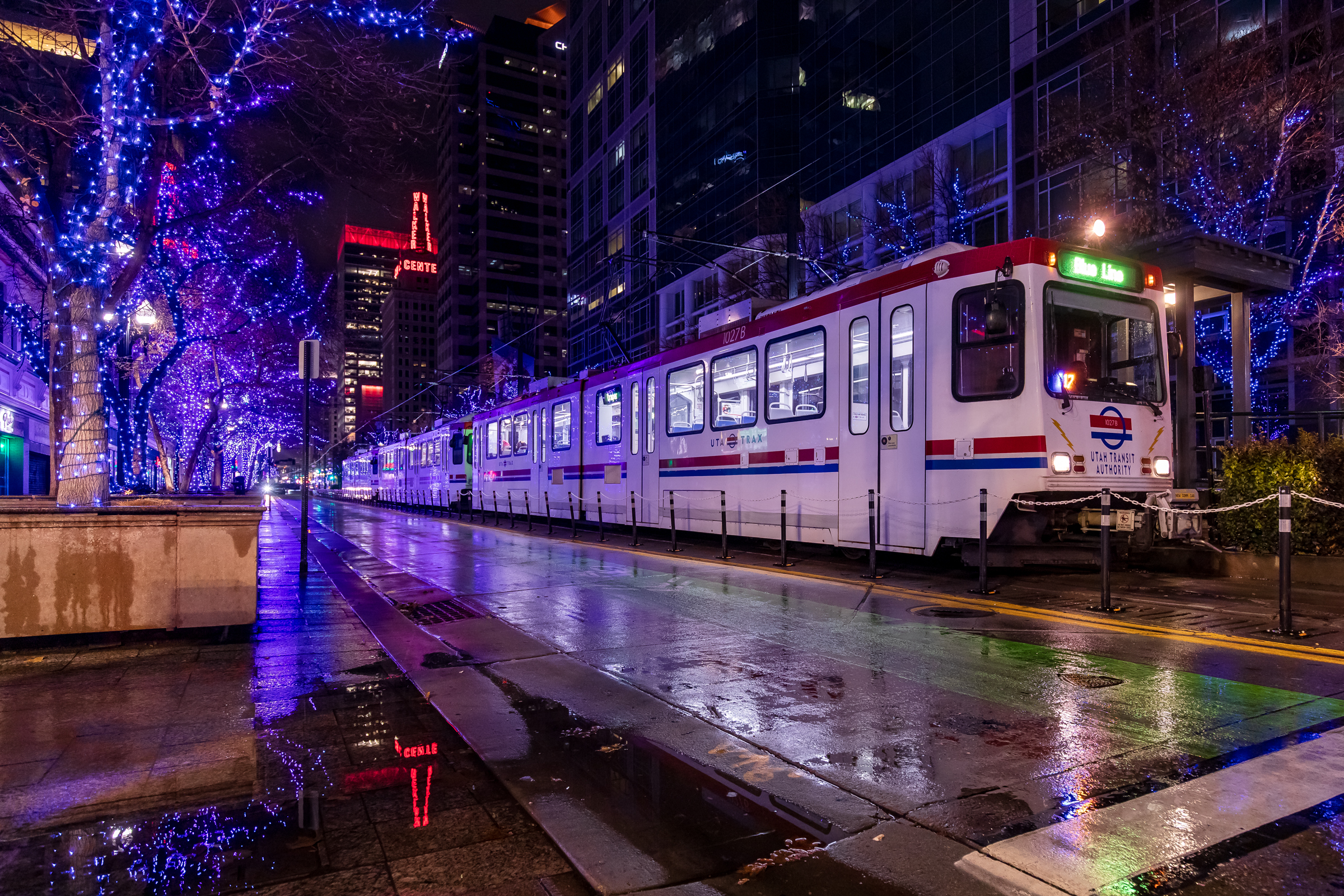 A TRAX train stops at Gallivan Plaza station as rain falls in downtown Salt Lake City on Dec. 28, 2024. Many storms that have hit Utah this season have been too warm for heavy valley snow.