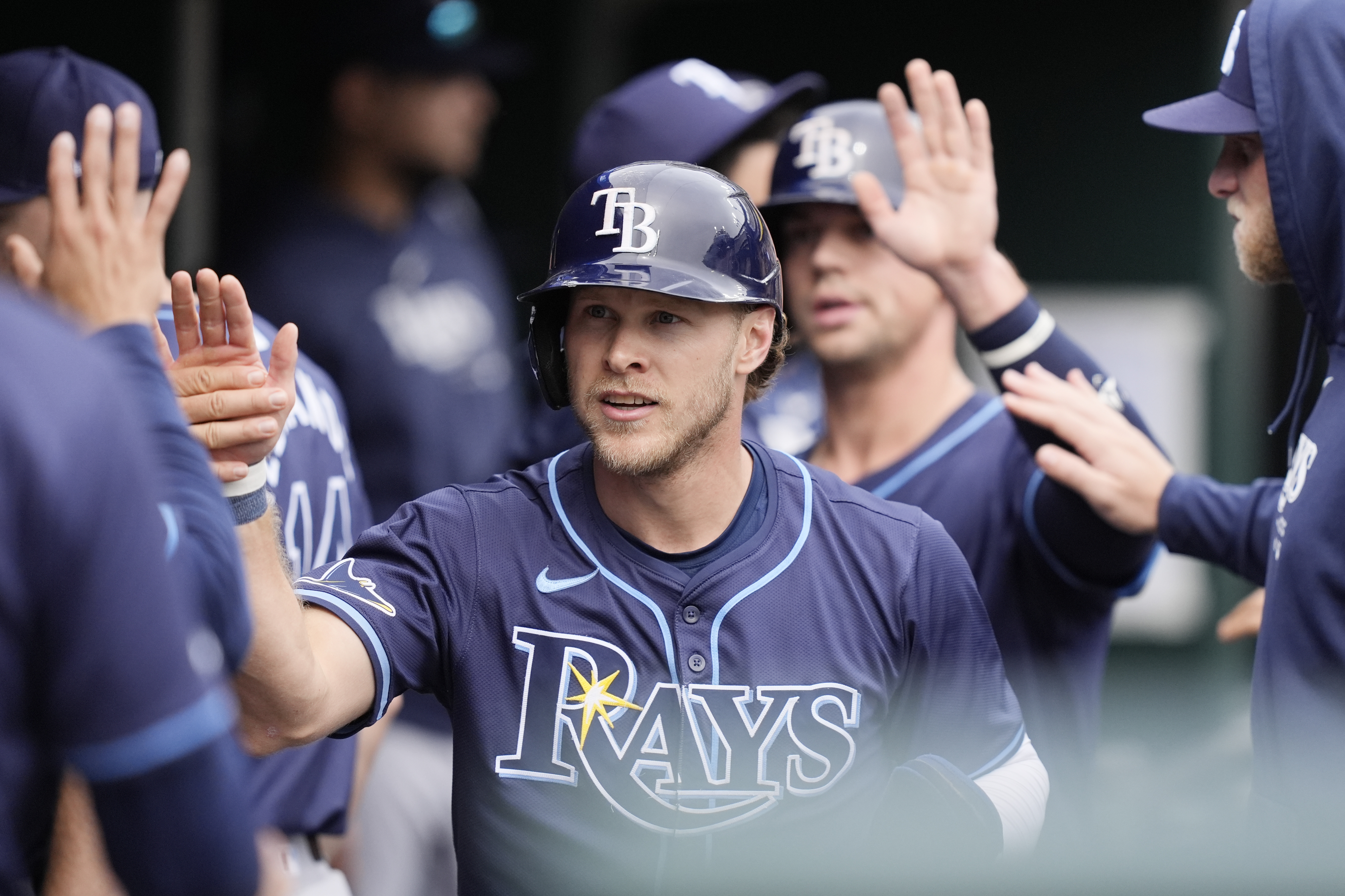 FILE - Tampa Bay Rays' Taylor Walls is greeted in the dugout after scoring in the third inning of a baseball game against the Detroit Tigers, Thursday, Sept. 26, 2024, in Detroit.
