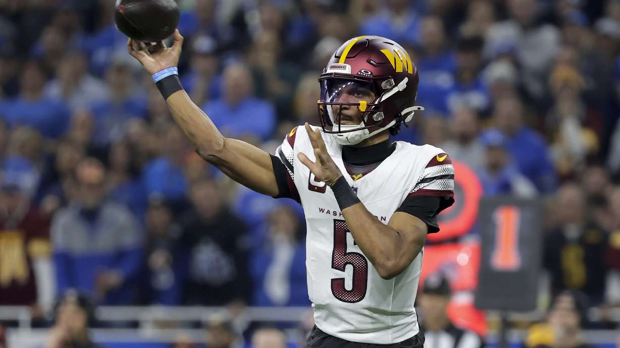 Washington Commanders quarterback Jayden Daniels (5) throws against the Detroit Lions during the first half of an NFL football divisional playoff game, Saturday, Jan. 18, 2025, in Detroit.