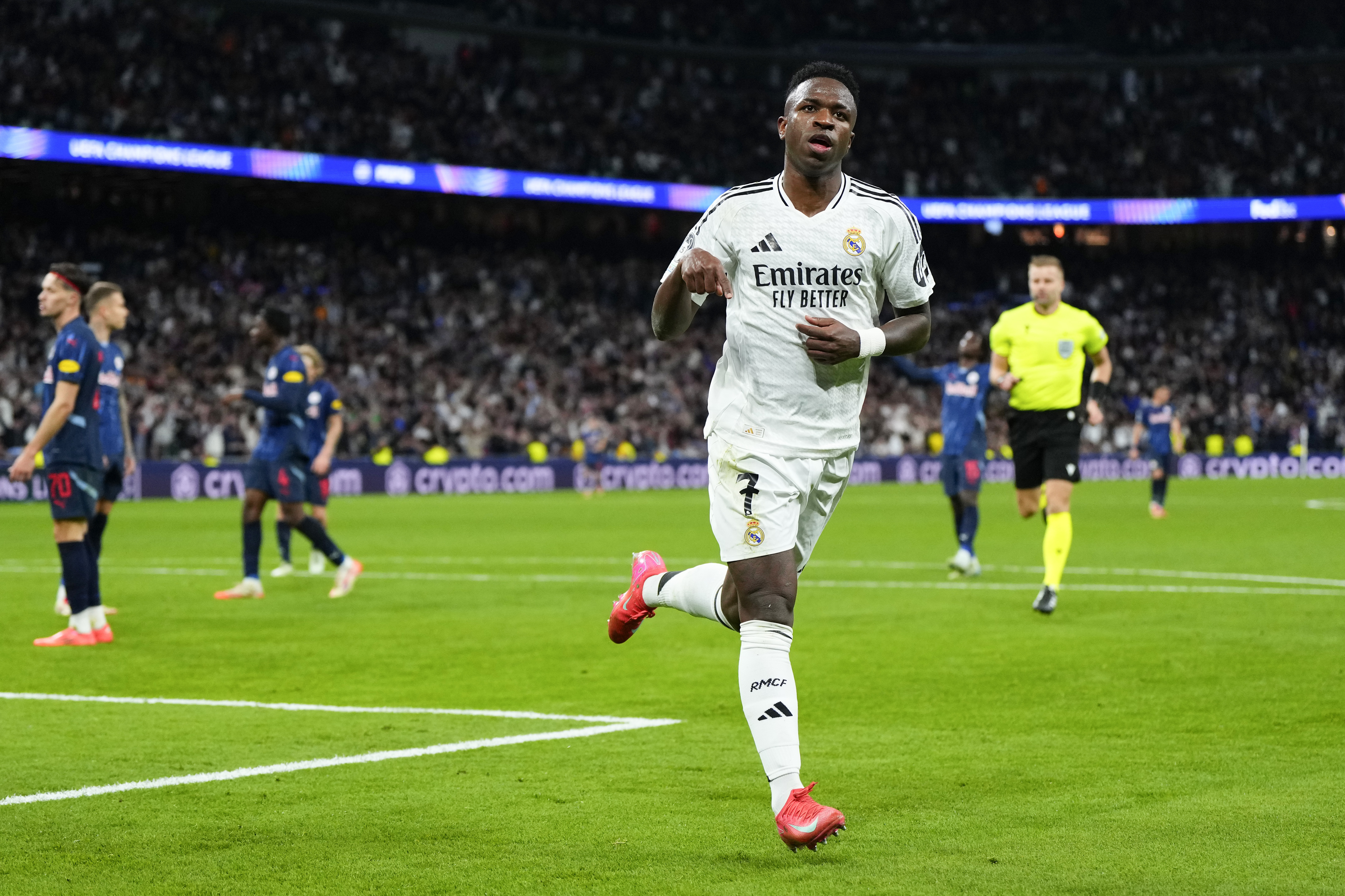 Real Madrid's Vinicius Junior celebrates after scoring his side's 5th goal during the Champions League opening phase soccer match between Real Madrid and FC Salzburg at the Santiago Bernabeu stadium in Madrid, Wednesday, Jan. 22, 2025.