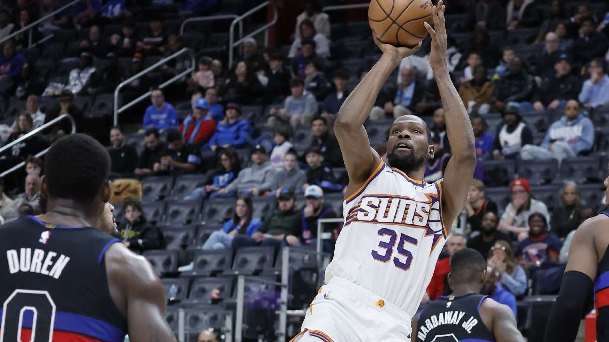 Phoenix Suns forward Kevin Durant (35) looks to shoot against Detroit Pistons center Jalen Duren (0) during the second half of an NBA basketball game Saturday, Jan. 18, 2025, in Detroit.