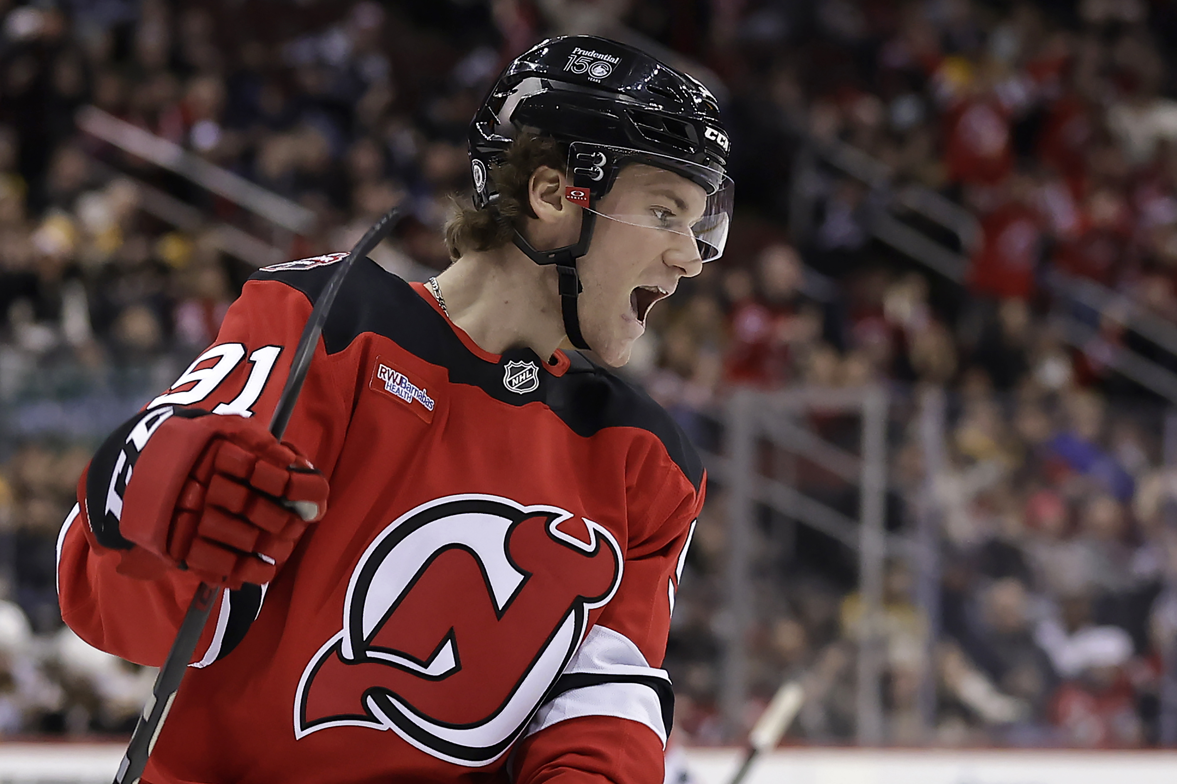 New Jersey Devils center Dawson Mercer reacts after scoring a goal during the second period of an NHL hockey game against the Boston Bruins Wednesday, Jan. 22, 2025, in Newark, N.J.