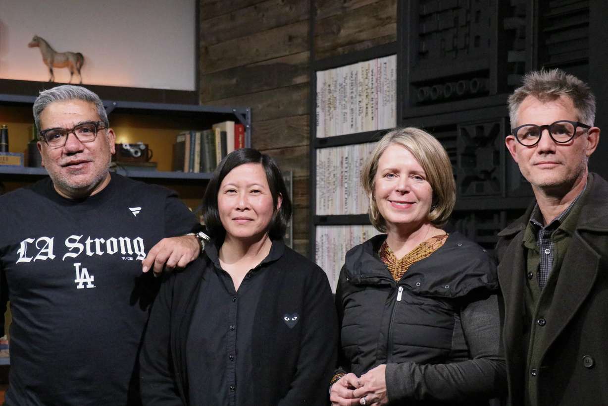 Eugene Hernandez, Kim Yutani, Amanda Kelso, and John Nein pose for photographs after a press reception Wednesday in Park City ahead of the 2025 Sundance Film Festival.