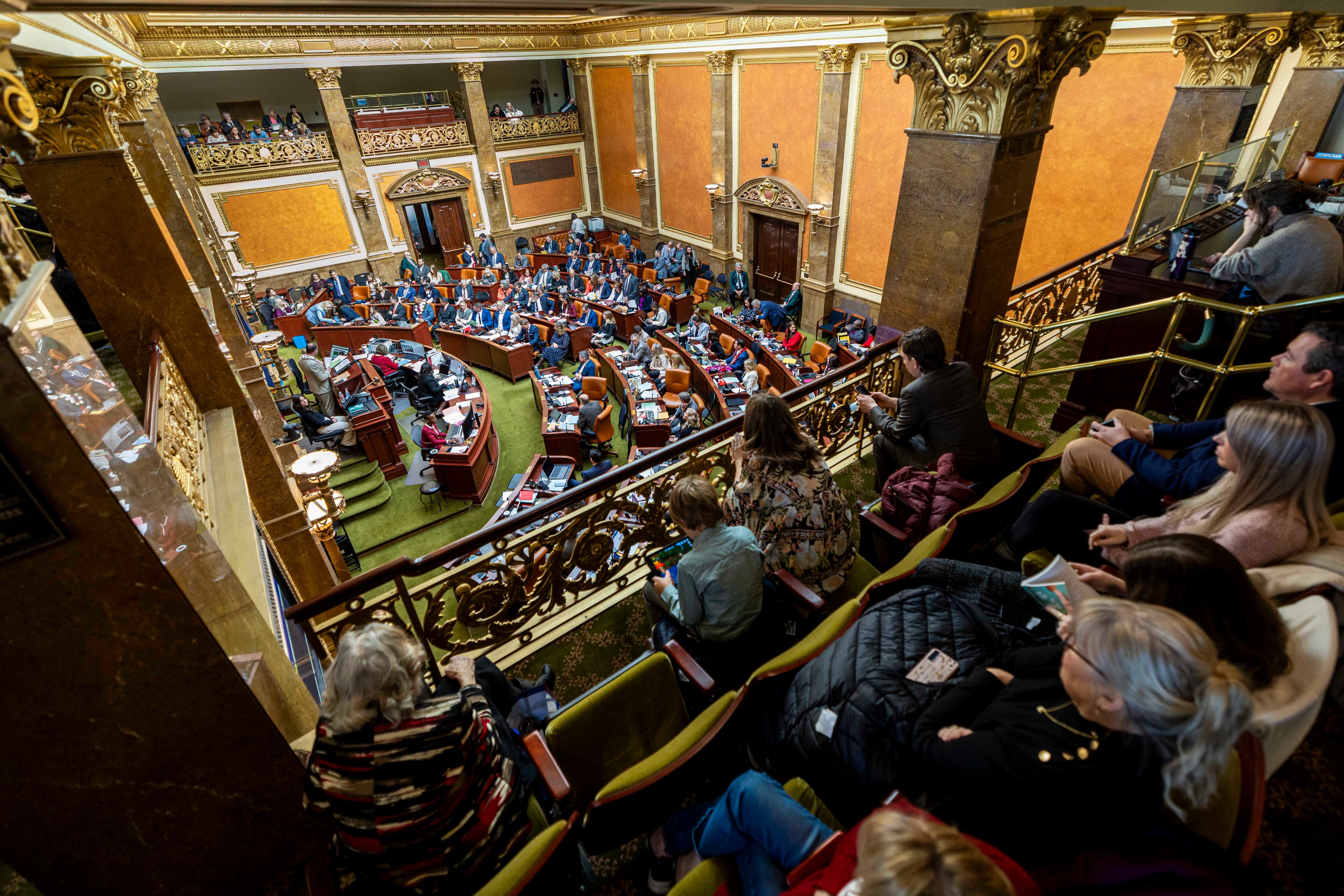 Attendees listen as the Utah House of Representatives hold their first session of the year in their chamber at the Utah State Capitol in Salt Lake City on Tuesday.