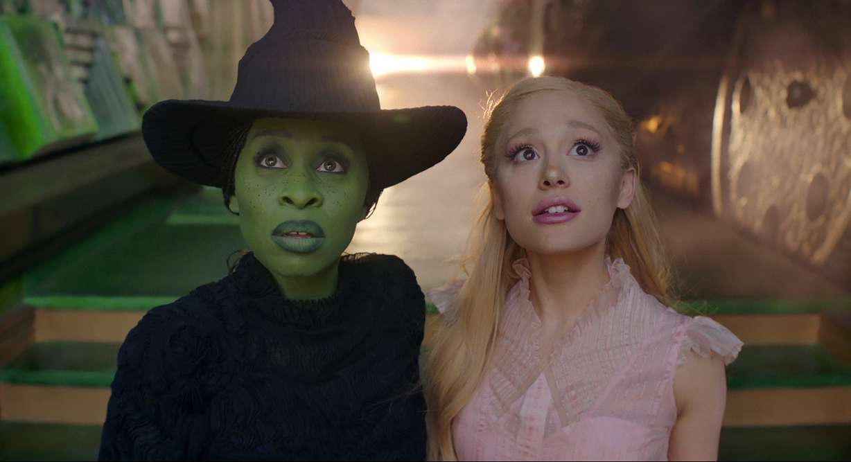 This image released by Universal Pictures shows Cynthia Erivo, left, and Ariana Grande in a scene from the film "Wicked."