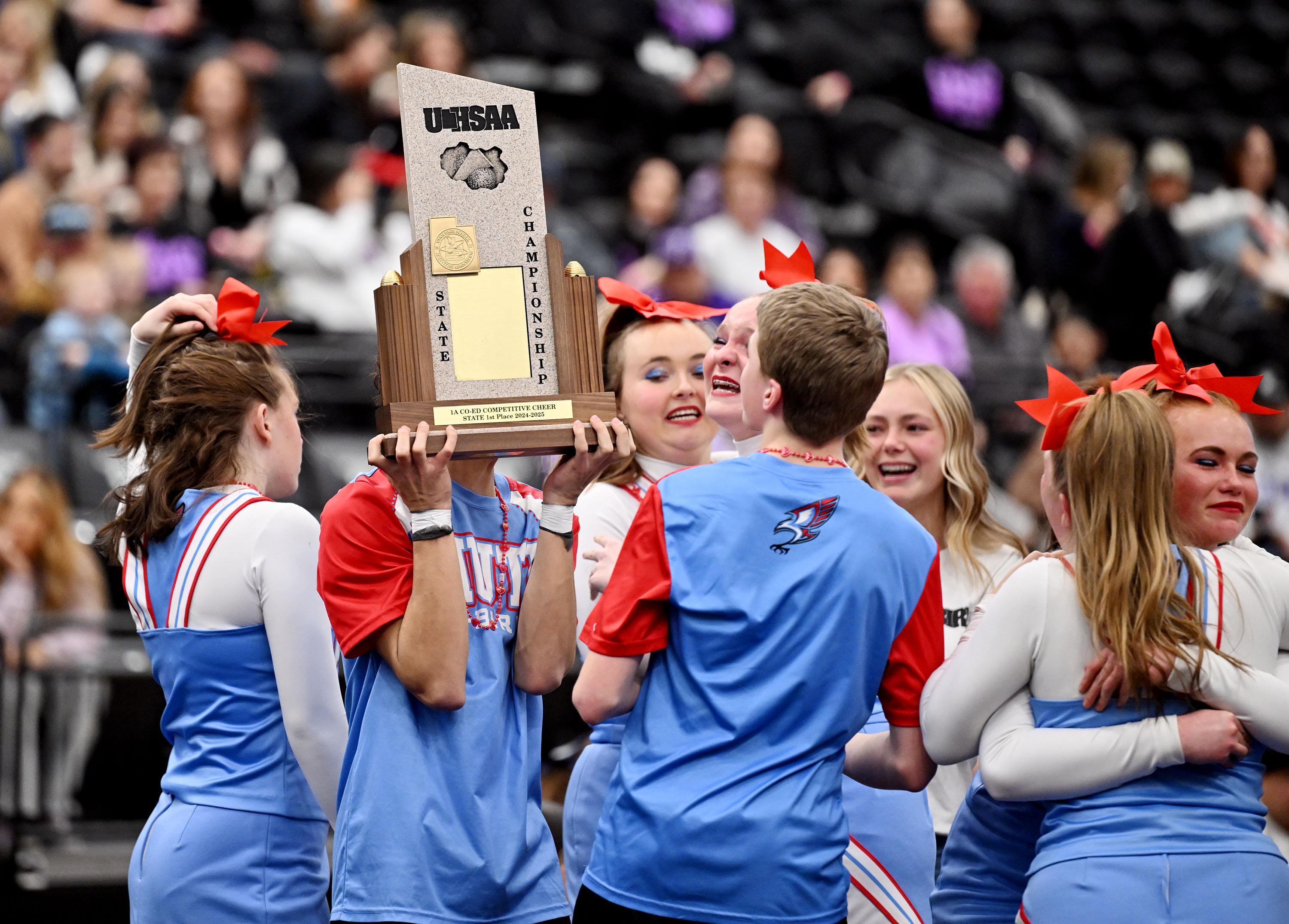 Piute High cheerleaders celebrate their coed state win as teams from 1A and 2A compete at UVU in Orem on Wednesday January 22, 2025.