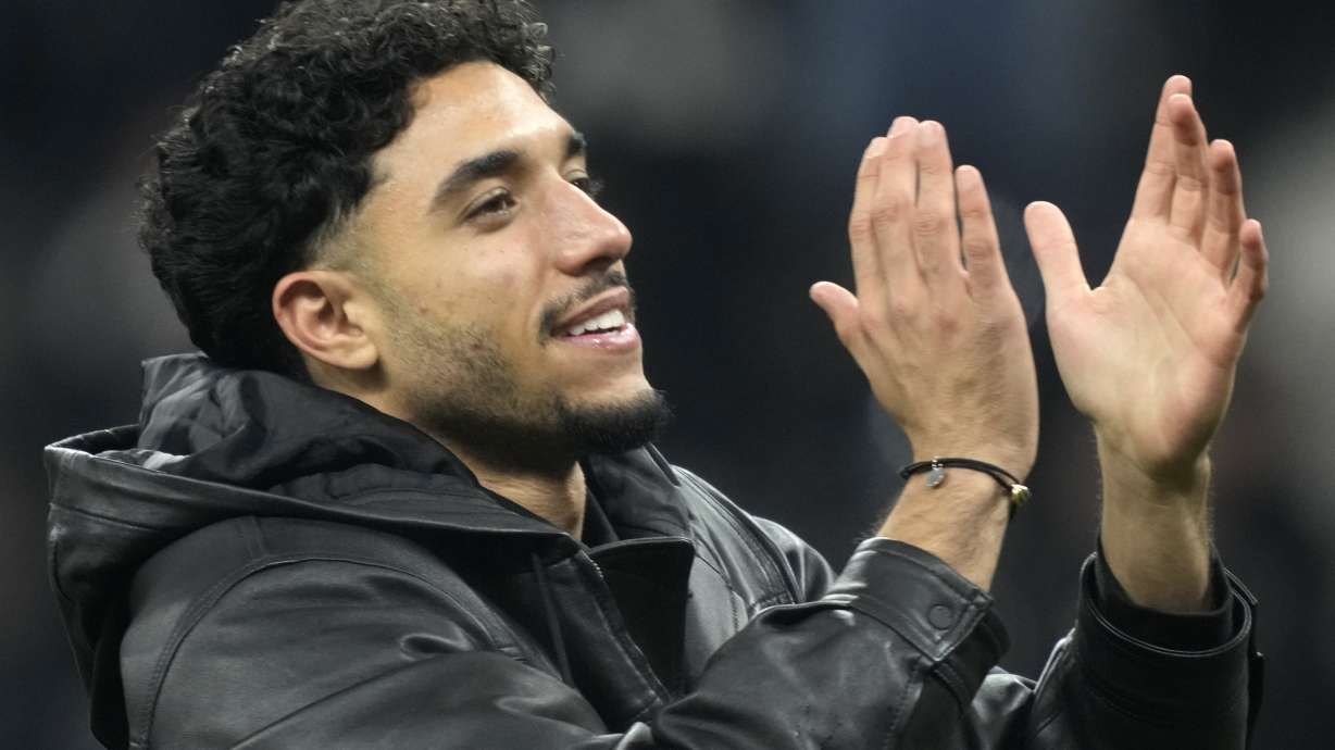 Frankfurt's Omar Marmoush greets fans after the German Bundesliga soccer match between Eintracht Frankfurt and Borussia Dortmund in Frankfurt, Germany, Friday, Jan. 17, 2025.