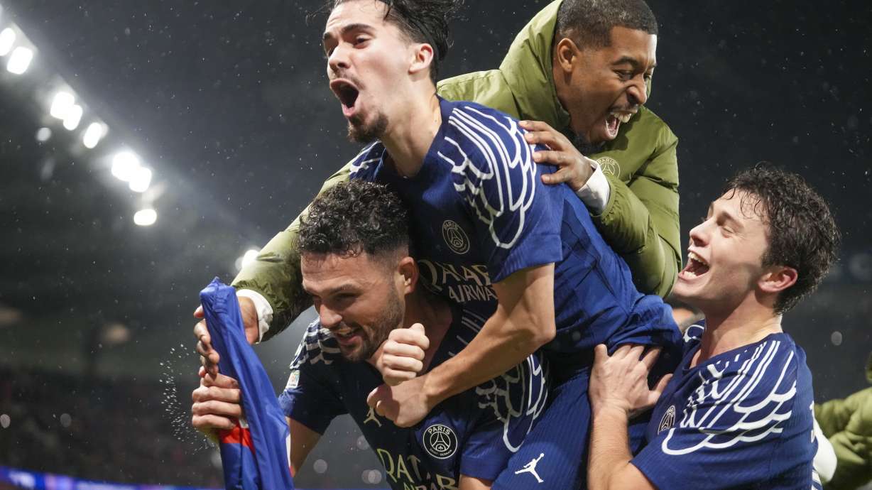 PSG's Goncalo Ramos, bottom left, celebrates with teammates after scoring his side's fourth goal during the Champions League opening phase soccer match between Paris Saint-Germain and Manchester City at the Parc des Princes in Paris, Wednesday, Jan. 22, 2025.