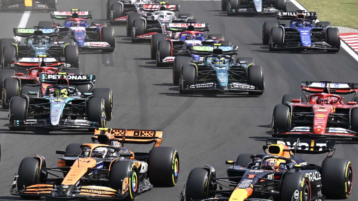 FILE - Drivers with their F1 cars start for the Hungarian Formula One Grand Prix race at the Hungaroring racetrack in Mogyorod, Hungary, Sunday, July 21, 2024.