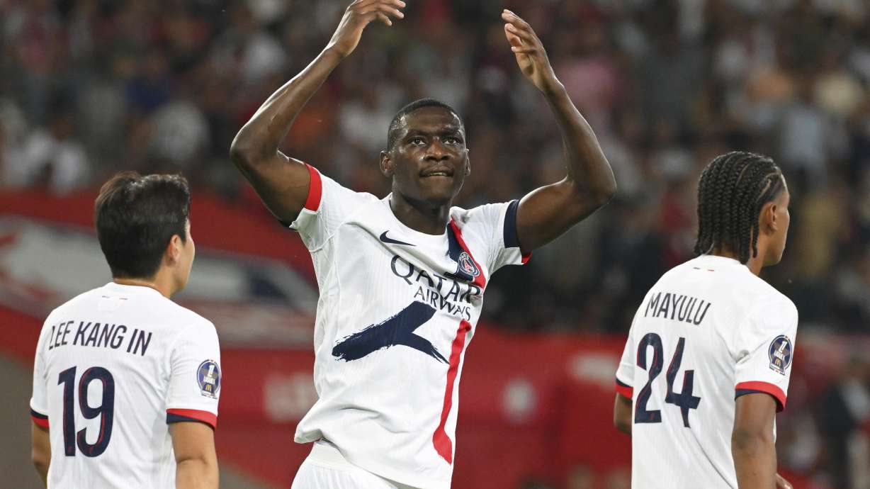 FILE- PSG's Randal Kolo Muani celebrates after scoring his side's third goal during the French League 1 soccer match between Lille and Paris Saint-Germain, in Villeneuve-d'Ascq, France, Sept. 1, 2024.