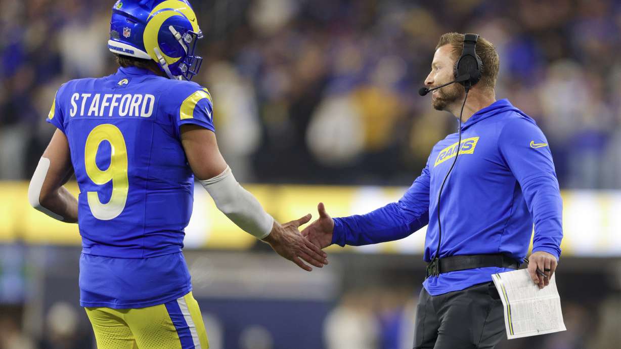 Los Angeles Rams quarterback Matthew Stafford (9) celebrates his team's rushing touchdown with head coach Sean McVay during the first half of an NFL football game Saturday, Dec. 28, 2024, in Inglewood, Calif.