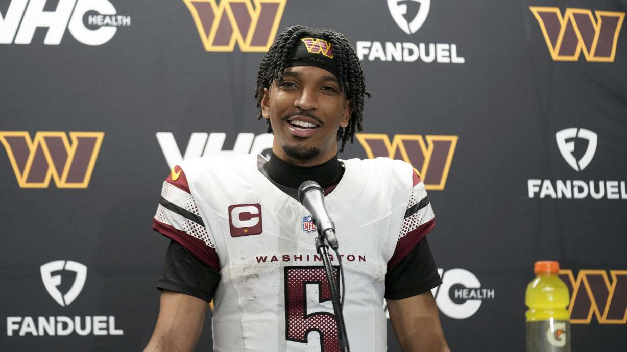 Washington Commanders quarterback Jayden Daniels talks to the media after an NFL football divisional playoff game against the Detroit Lions, Sunday, Jan. 19, 2025, in Detroit.